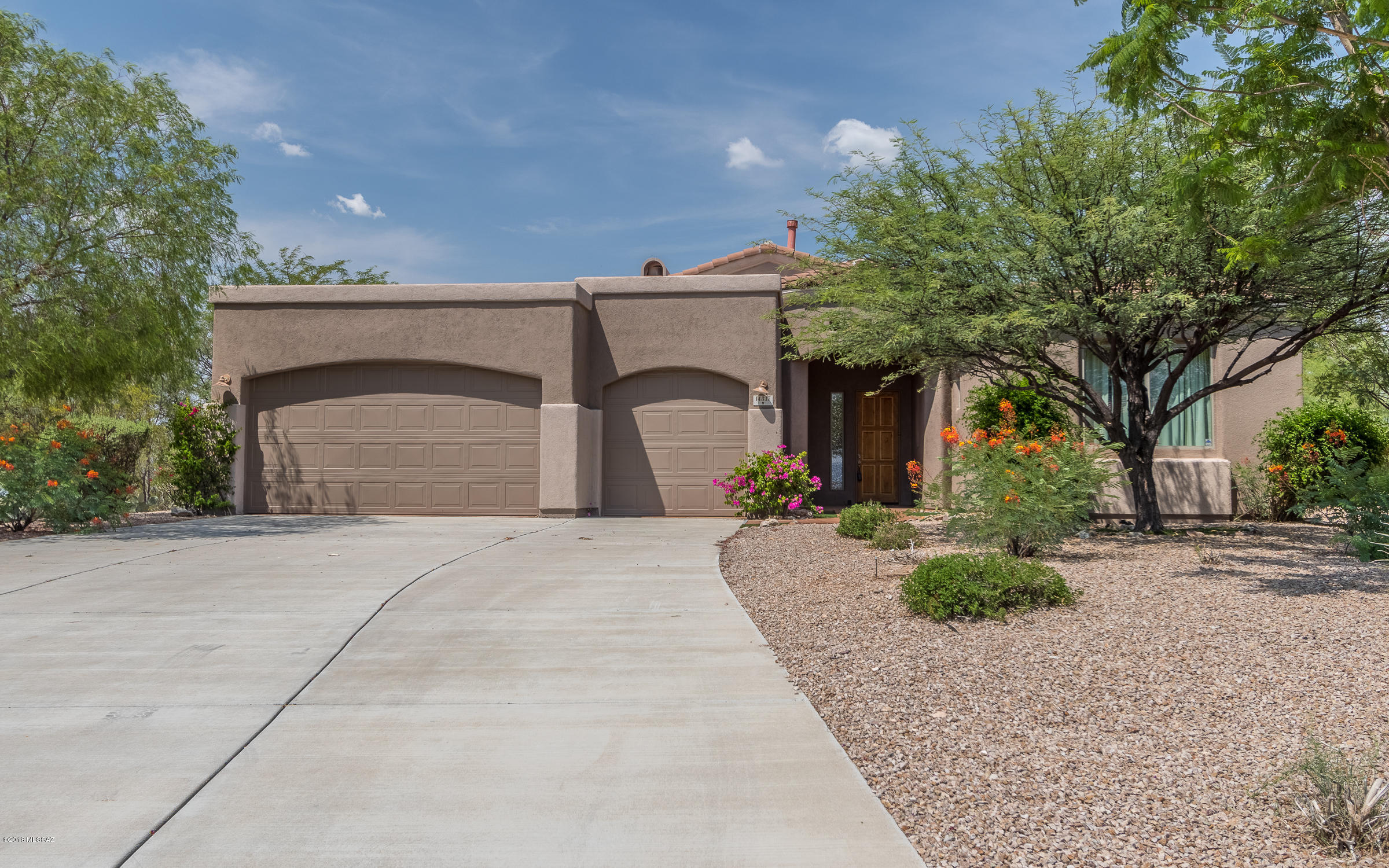 Gorgeous ''model'' home located in sought after Vail school district. Features a huge backyard with a dog run and ready for a pool if you wish. Gorgeous Rincon mountain views and a big covered, north facing patio. The inside has just been re-painted and ready to move in. The bedrooms are efficiently laid out and the living and family rooms are nicely sized for lucky new owners. A true retreat from the daily rat race and an Oasis in the desert for the most demanding clients!
