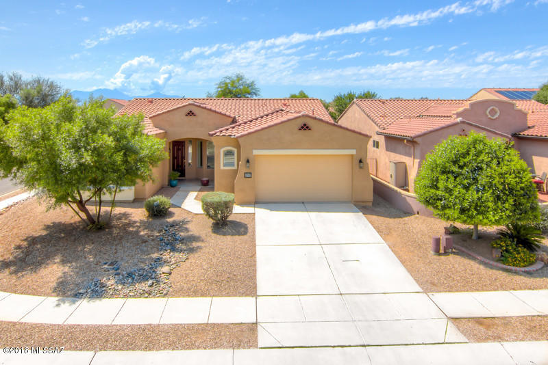 ***MOVE IN READY***Beautiful Large Single Story Home on a corner lot in the desirable Presidio Del Valle Neighborhood in Rancho Sahuarita,This 3 Bedroom 2 Bath with 2,142 SQFT 2 Car Garage Home with a formal dining room,Home offers plantation shutters throughout,Family room has laminated beautiful flooring,Property is on a large corner lot just a short walk to all the great amenities Rancho Sahuarita has to offer. You will enjoy this great open floor-plan with lots of natural light,Backyard has an extended porch for those amazing family gatherings, Large master suite with large bathroom & Closet,Don't Miss this opportunity it will not last long, Call to schedule a private tour of the home today.