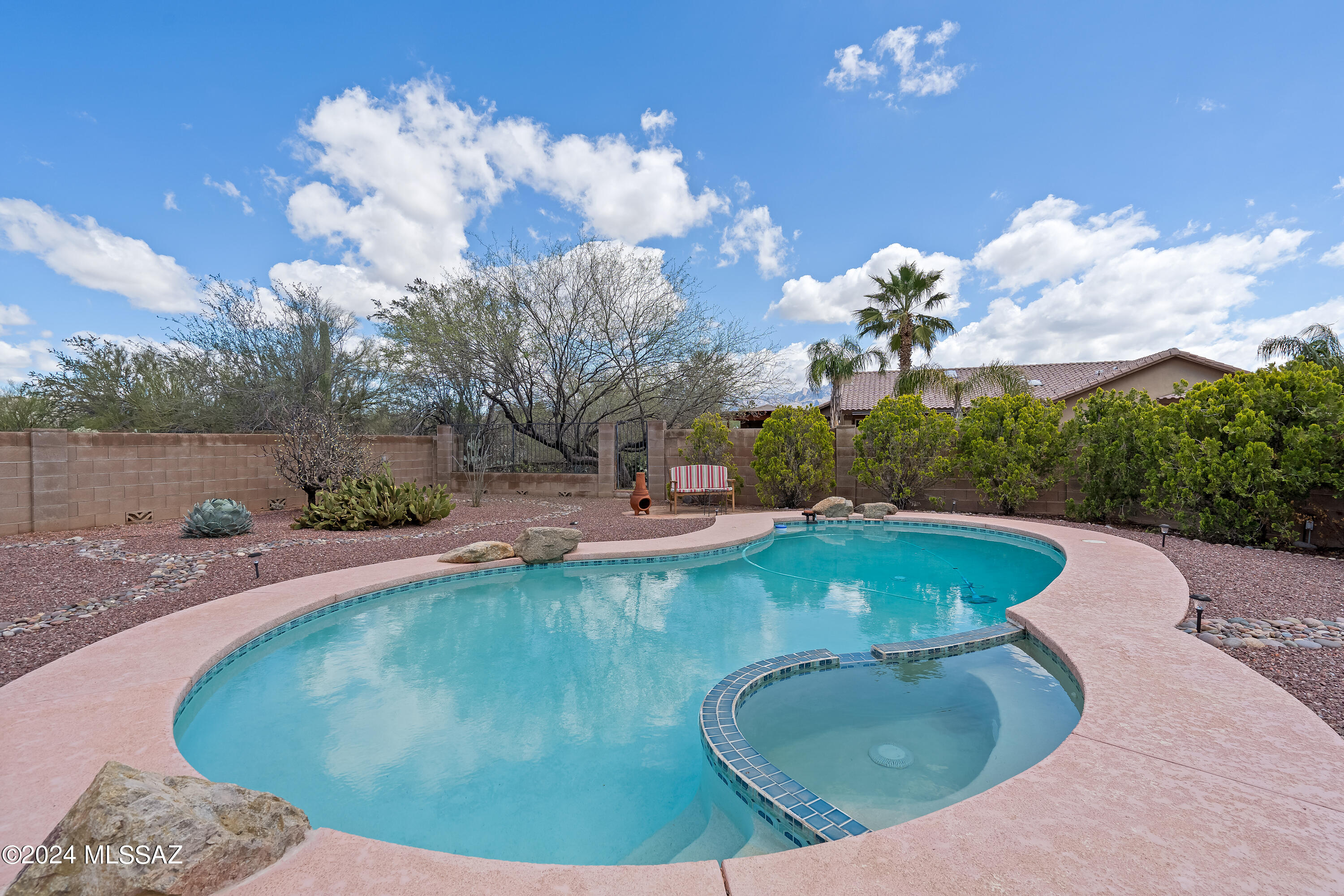 Prime location, no HOA! Pristine home on a .38 acre cul-de-sac lot w/gorgeous mountain views! Open, versatile family floorplan w/spacious formal living room, family room w/fireplace opening to kitchen & multiple bedrooms, including a large downstairs bdrm that can double as a 2nd primary suite. Updated cook's kitchen w/huge center island, extended breakfast bar, beautiful cherry cabinetry, granite counters, gas range, & walk-in pantry. Huge primary suite w/walk-in closet, dual sinks, separate shower & garden tub. Private backyard oasis that has it all & ideal for entertaining!!  Mountain views, huge pool, spa, 20x30 paver patio, basketball court, citrus trees, low care landscaping & 2 sheds. Large 3-car garage w/workbench & easy backyard access. Great location-near shopping & schools!