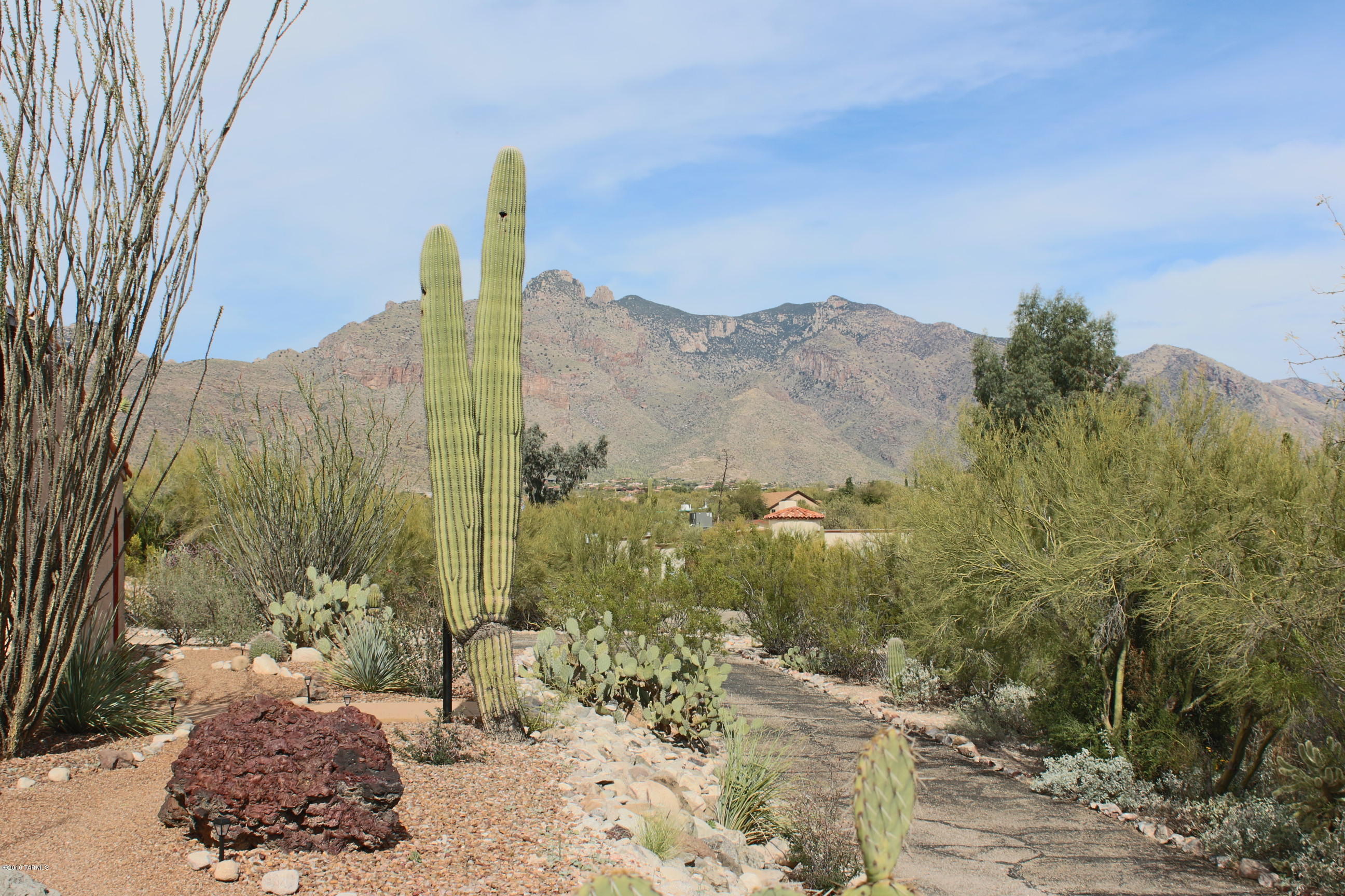 Range Priced $339,000-349,000 ... Lovely four bedroom home on elevated lot in District 16 featuring a sparkling pool, mountain views, split bedroom floorplan, Family Room AND Living Room, two car garage, wood beam ceilings, one beehive fireplace in the Family Room, one beehive fireplace on the patio, travertine countertops in Bathrooms, ceiling fans throughout, recessed lighting, an efficient Kitchen with granite countertops and stainless steel appliances and so much more! Great indoor/outdoor space for entertaining, long driveway with two separate entrances/exists, lots of additional parking all sitting on .77 acre. This house won't last!!!