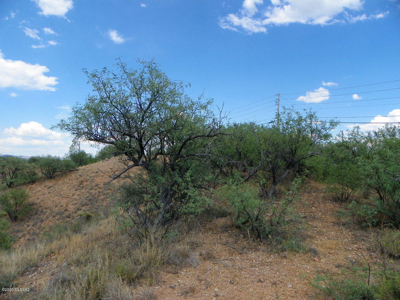 Mostly hillside.  Someone with a tractor could make this lot work.  Or an adjoining land owner might want to add this nearly 2 acres to their property.  Electric is at the street and most likely the water is too but should verify with the water co.