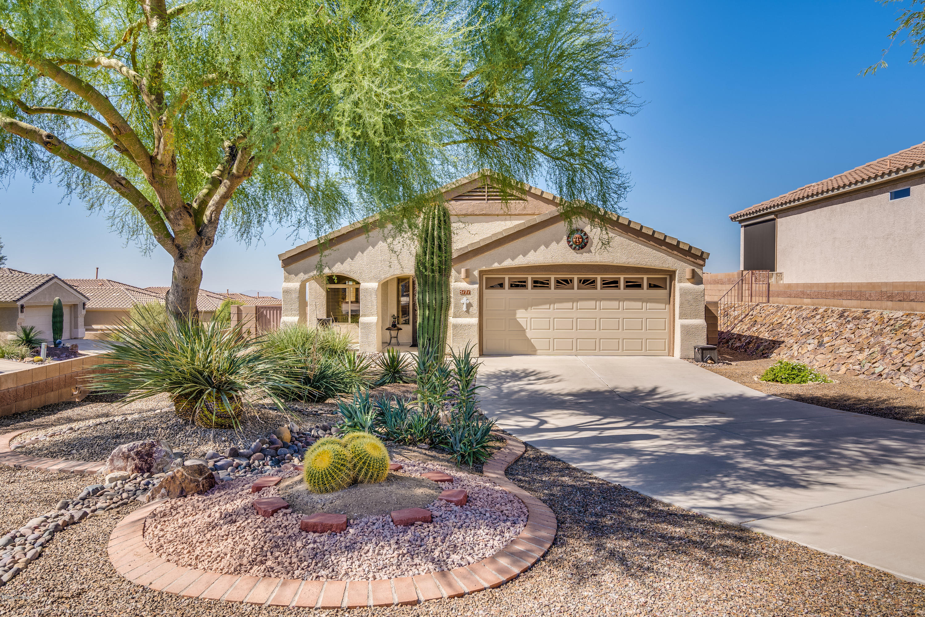 Very special house on over-sized lot that stands above and apart from neighbors, providing privacy and panoramic sunset views unmatched in this neighborhood. Was 4 bedroom, but 2 smaller bedrooms have been converted into a large guest suite with TV area perfect for visitors. Plenty of space with living/dining room, 3rd bedroom/office, and family room off of the open kitchen with breakfast bar. Freshly painted inside and out, new carpeting, new water softener, updated fixtures, and a beautifully landscaped backyard for outdoor living. Lovingly maintained and cared for, this home n gated 55+ Heritage Highlands, is just minutes to golf, tennis, swimming, all the amenities at The Heritage Club and hiking trails in the Torolita Mountains.