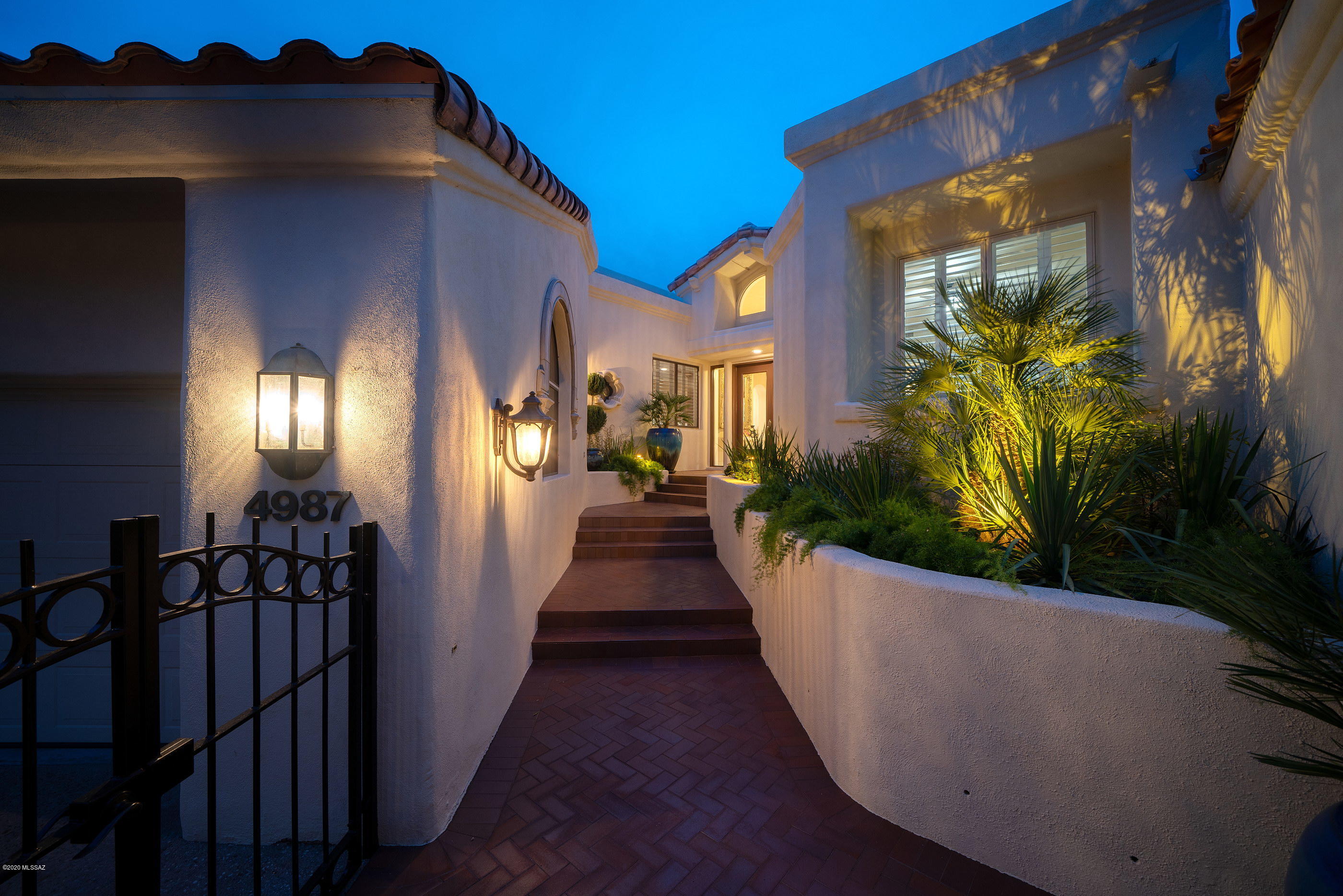 Set in the exclusive guard gated community of Skyline Country Club on a prime golf course lot, exudes Luxury, Lifestyle and Exclusivity, anchored by 24­-hour security. Retaining the essence of the original architecture, whilst creating a renewed vision of amenities and services an owner of this caliber would expect, providing a conception of light, functionality and design, highlights the coveted and sweeping Catalina Mountain views to the North. This impressive home with both bedrooms and baths on the downstairs and a flex space (office, den, media room) upstairs, was completely updated in 2019. The fit out and quality of finish is incomparable, proportioned with elegant architectural features and large windows framing views of the adjacent fairway. This stunning home has been completely overhauled and reimagined with new flooring, cabinetry, paint, and fixtures, utilizing a delicate balance of materials, textures and finishes, bringing a sense of casual elegance to the space (see Features Sheet in documents section). 

As one travels between the individual spaces, dramatic landscapes unfold, allowing for an abundance of natural light from every room. Transparent facades and walls of glass fuse the indoor and outdoor living environments, used to derive a sense of spatial richness, that physically connects the interior to a generously shaded veranda. This experience creates a gradual transition from the materially warm interior spaces, to the outdoors that are perfect entertainment, or simply watching the evening sunsets melt across the Catalina mountains.