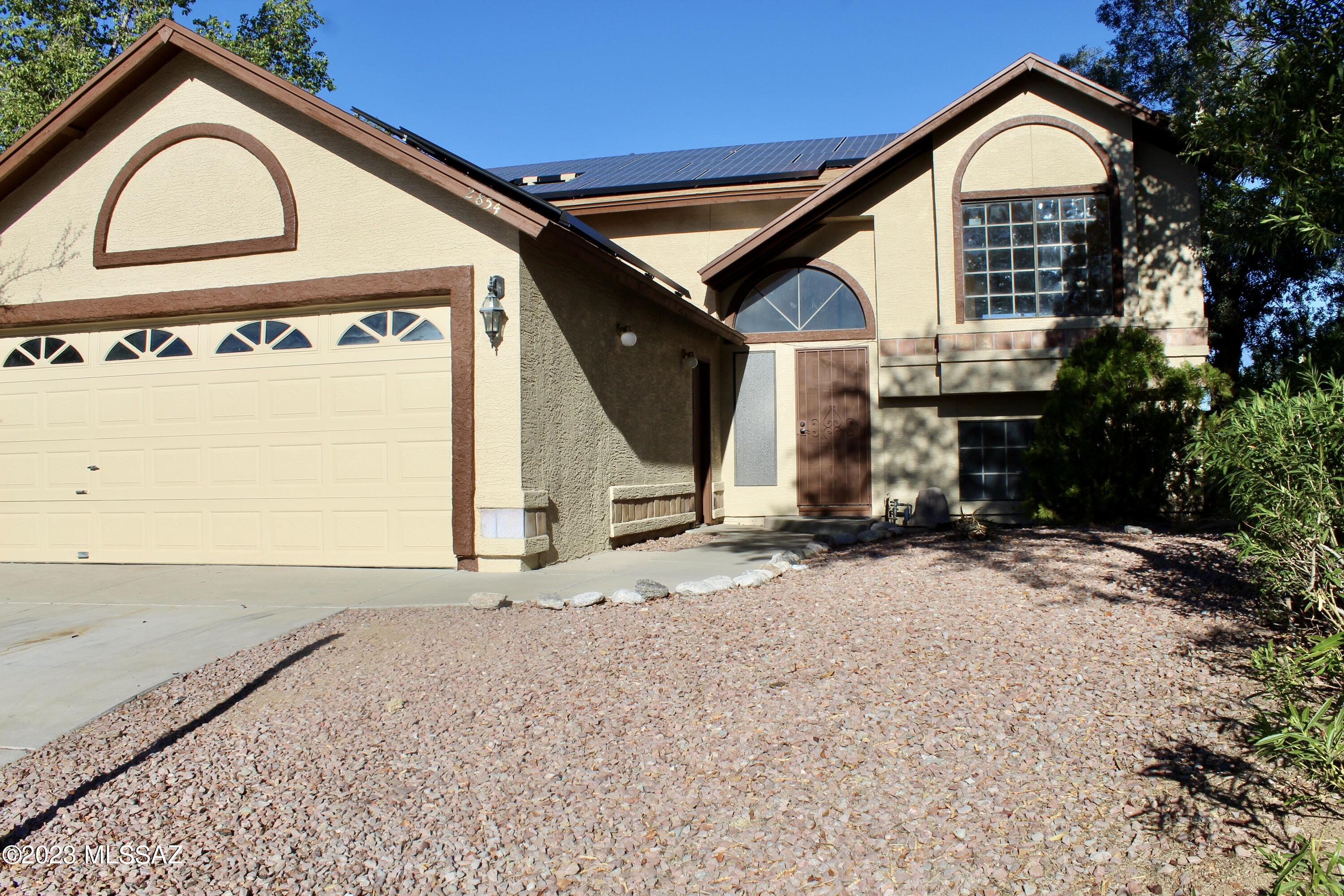 Multi level 4 bedroom 2 and 1/2 bath home on large corner lot with pool located NW side. Upstairs; living room, kitchen, dining area, half bath plus 2 guest bedrooms with Jack & Jill bathroom. Kitchen offers plenty of cabinet and counter space with granite counter tops, pantry, open to dining area and natural lighting throughout. Downstairs you'll find the spacious primary bedroom, large walk-in closet in primary bathroom with dual vanities, separate shower and garden tub. 3rd guest bedroom, family room & laundry room downstairs as well. Check out the huge backyard with mature trees for extra shade, fenced in pool area and a playset that will convey. Exterior has been recently painted. Property needs some TLC & priced accordingly.