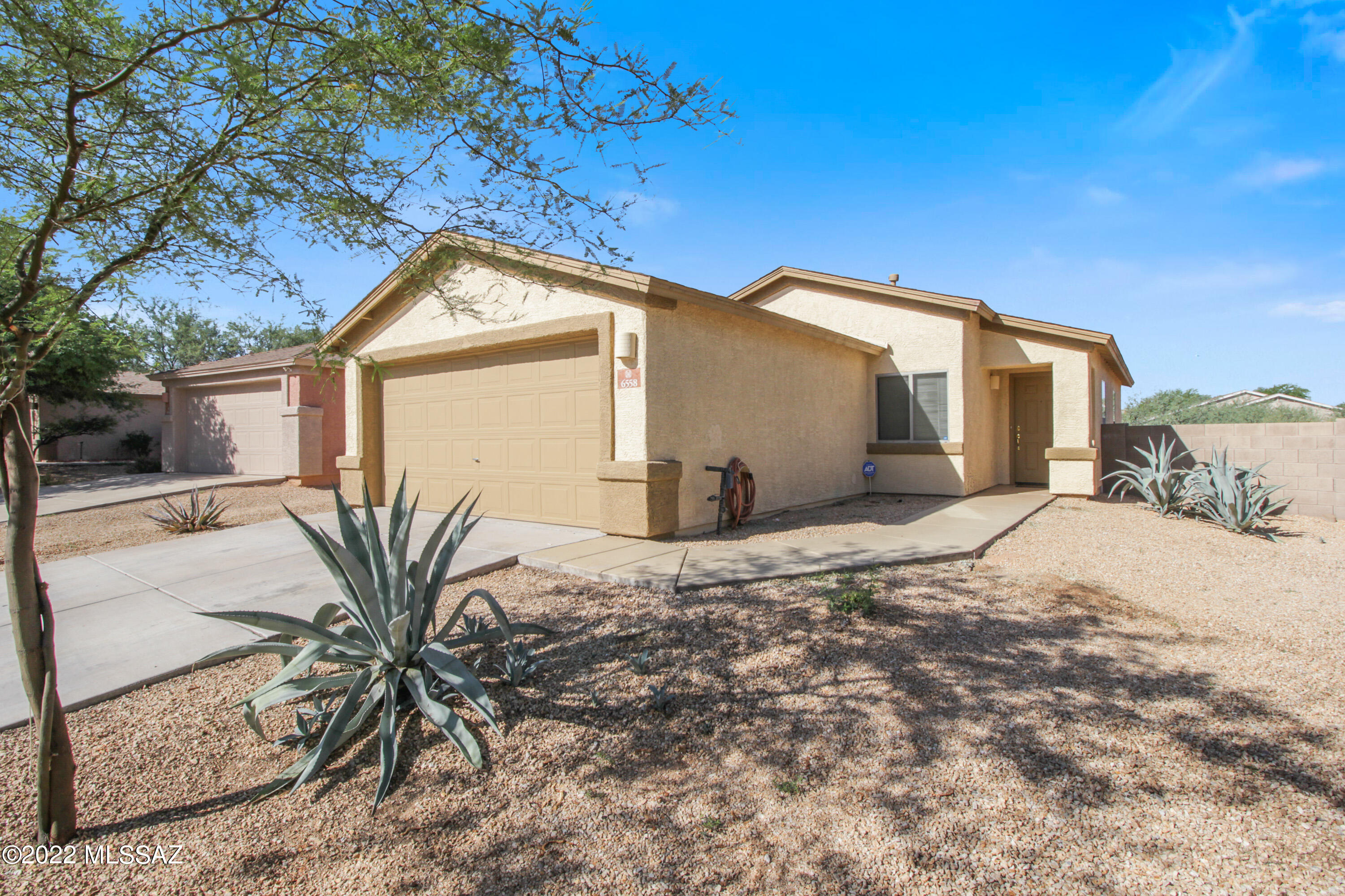 SUPER CLEAN, move-in ready! On one of the largest lots in the subdivision, no neighbors directly behind. View fencing for a natural desert backdrop. Quaint neighborhood park nearby. 3 bedroom, 2 bath. 2-car garage. Refrigerator, washer and dryer convey. Low HOA, easy-care front and backyards. Stainless steel appliances. Vaulted ceilings! Neutral paint colors, all that's needed is your furniture and decor. Natural light, dual-pane windows. Beautiful starry nights on the West side of Tucson! Firepit, drive-through gate for extra parking/vehicles/future construction vehicles for the addition of a swimming pool or other landscaping dreams come true. Minutes to Casino del Sol, chock full of fine-dining, entertainment and live music. Buyer to verify all facts and figures, including those in MLS.