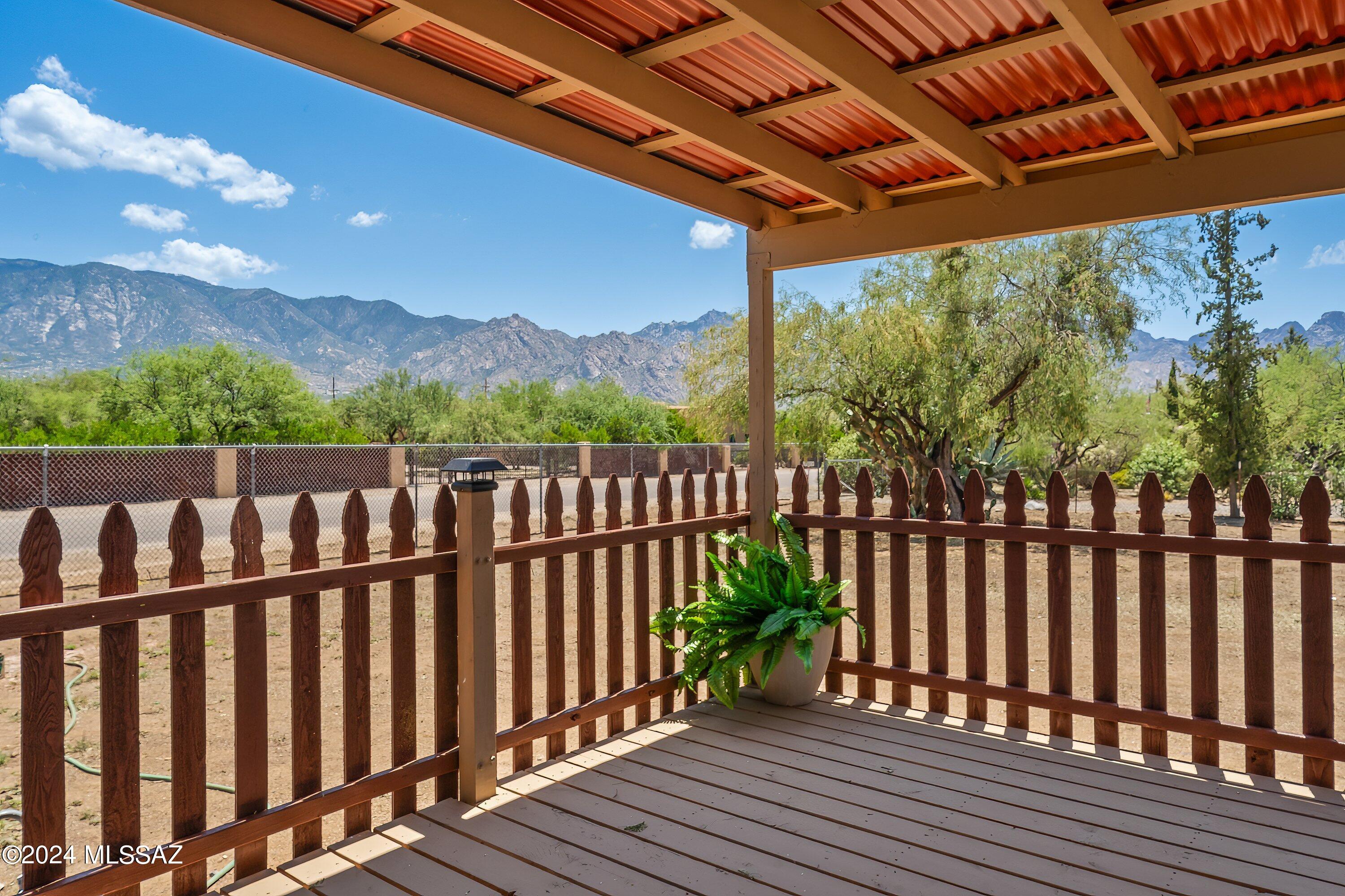 Remodeled manufactured home with spectacular views of the Catalina Mountains. Gorgeous inside boasts new kitchen, new tub/showers, new vanities, new paint interior and exterior, new flooring throughout. Walk out your sliding glass door and enjoy your new covered deck with beautiful mountain views. Home sits on the corner, leaving 1/2 of the property for you to use your imagination. A workshop, barn, horse facilities, garden or whatever your needs are. Horse lovers, ride to the state land for miles and miles! No HOA of course. Call for your appt. to view this magnificent home.