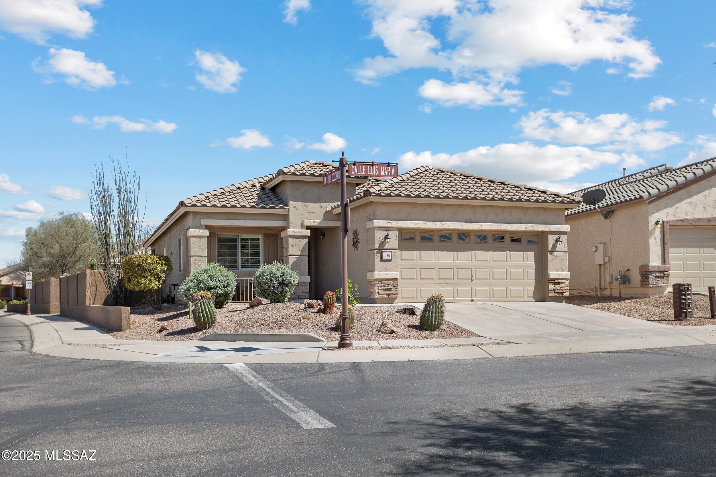 Welcome to your oasis in Del Webb, Sahuarita's premier +55 active adult community! This 1,500 sqft corner-lot home combines comfort and style with granite countertops in the kitchen and bathrooms, and plantation shutters throughout. The open floor plan features 2 spacious bedrooms and 2 full baths, including a generous guest suite with two walk-in closets and direct access to the secondary bath—perfect for visitors or multi-use space. Step outside to a beautifully landscaped, low-maintenance backyard with mature shrubs, gravel, and an Alumawood gazebo ideal for enjoying Arizona's sunny days. Del Webb offers an unmatched lifestyle with access to a resort-style pool, pickleball, tennis courts, bocce ball, fitness center, and countless other amenities and social clubs.