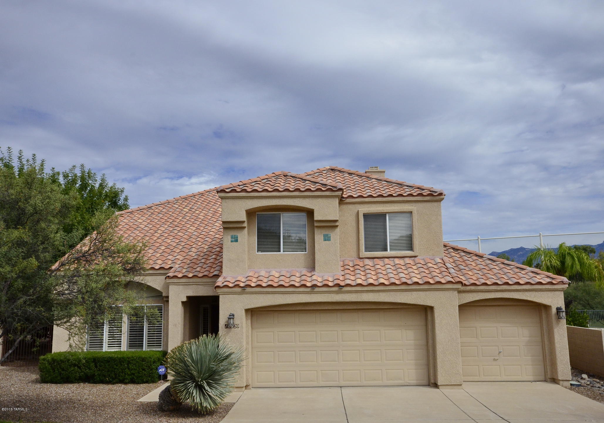 Great Price Adjustment. Priced to Sell! Spacious 4 bedroom home with entertaining backyard: pool, fire pit, extended large rear porch and patio areas with Catalina Mountain and golf course views.  Highly desired 3 car garage.  Updated kitchen boasts stainless steel appliances.  Neutral ceramic tile and high end carpet throughout home. Master bedroom has large balcony to enjoy gorgeous views.  Large lot for area.