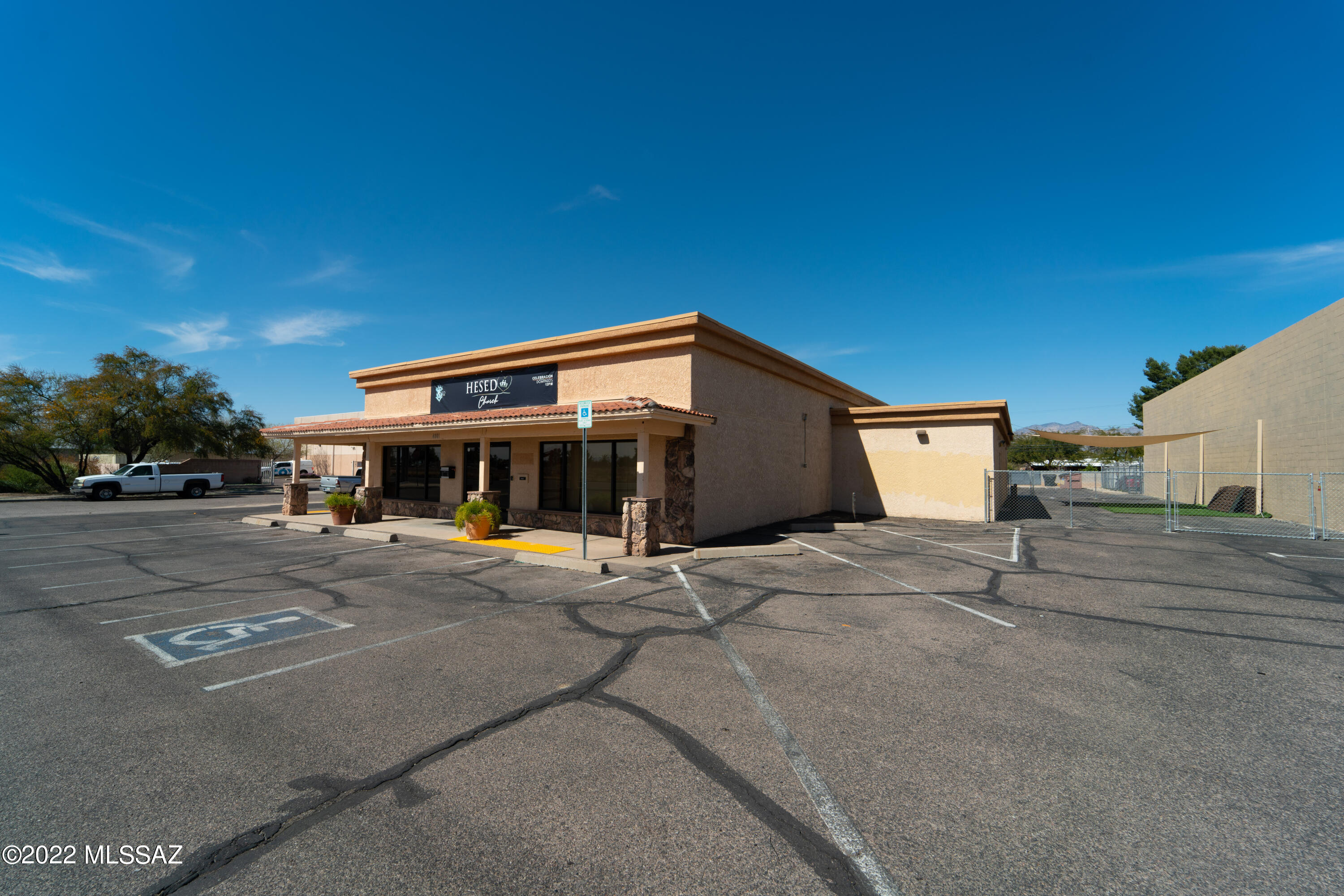 Large Building zoned C-2 presently being used as a Church. Many previous businesses have occupied this location in the past, 47 parking spaces on the lot with additional street parking as it is a corner lot.