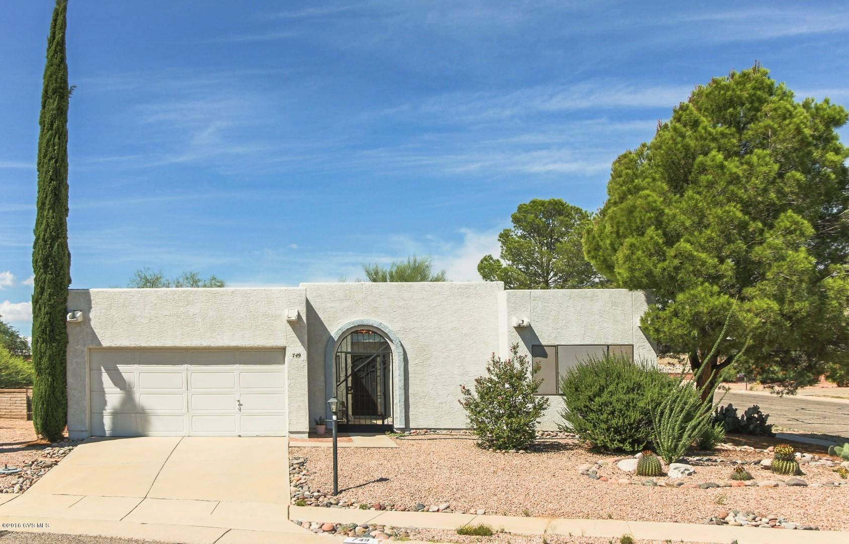 Green Valley living at its best. This single-family home on a large, corner lot in The Villages includes several features Green Valley residents want. You'll find a two-car garage, a large covered patio, an indoor atrium, and a den. The property features landscaping that is low care and perfect for the desert. The HOA includes a neighborhood recreation center with pool and spa. Green Valley Recreation is available for purchase but not required.