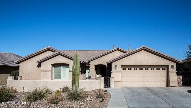 WOW! This house has it all  Mountain Views, PRIVACY adjacent to a wide arroyo, 3 Bedrooms (Extra Large Guest Room), 3 Baths, Den, Family Room off the Kitchen, Large Living/Dining Area, Casita with entry into the main house, AND a SEPARATE Workshop or Studio. 4' EXPANDED GARAGE with Built-in Cabinets, Utility Sink, Man Door & Insulated Walls & Ceiling. 17 Tile thruout the House, Casita & Studio. Plantation Shutters thruout. Kitchen has Cherry Cabinets, 42 Uppers & Roll-Out Lowers, SS Appliances, Eng. Stone Counters, Crown Molding, Large Pantry with Bi-fold Doors & Kitchen Nook with Bay Window. Laundry Room has LOTS of Cabinets, Sink & EXTRA Dishwasher! The Guest Room was Expanded 4 Ft & Guest Bath has a Soaker Tub/Shower. The Master Bedroom has a Bay Window overlooking the Arroyo  & Mountains with a door to the Expanded Patio. The Master Bath entry has Plantation Shutter Doorway. All Baths have Comfort-height toilets. The Relaxing Family Room has a Gas-Log Fireplace with Black Granite Surround. Low-E Double-Pane Windows, Soft Water, Stereo System Pre-Wired in Family Room, Master Bedroom & Guest Room (2 speakers/room). The house also has a Pre-Wired Security System. This house has it all! View this house and make it your home!
