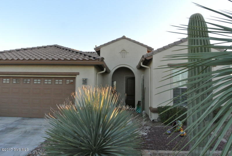 This home just sparkles! Lots of upgrades including granite counter tops, stylized light fixtures, tile in all areas but bedrooms, bay windows in the eating area and master bedroom, 4' garage extension. There is an custom designed and built fireplace/entertainment center complete with lights to show off your collectibles. The exterior was painted in late 2015. The lot is a cul de sac lot and has an expansive and private back yard with professional landscape - if you need a casita, workshop, golf cart garage, pool, you name it, there is room! The covered patio has been extended with brick pavers that lead to a remote controlled rock water feature. Yours to enjoy - move in ready. Home warranty included.