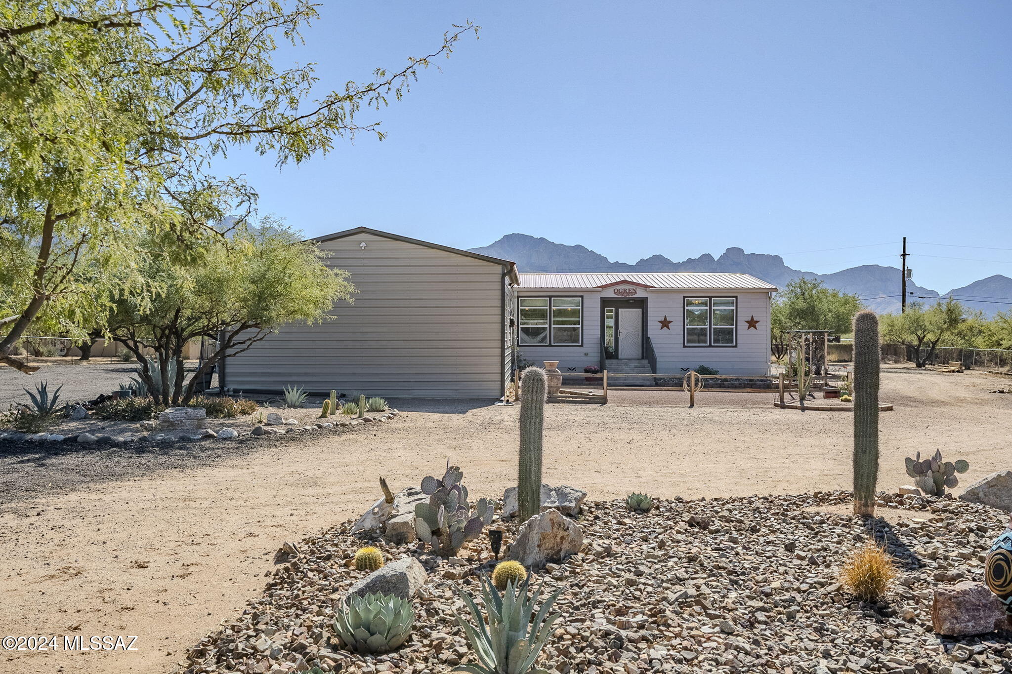 Nestled on a picturesque 1.06-acre lot, 3940 E Wilds Road offers a unique blend of rural charm and modern convenience. This 2020-built, 1,792 sq. ft. manufactured home boasts stunning mountain views, mature landscaping, and RV hookups. The property is horse-friendly, zoned for various residential uses, and has a flat, fenced layout that's ideal for outdoor living. Located near scenic trails, it's a perfect spot for nature enthusiasts and equestrians seeking a tranquil lifestyle with convenient access to local amenities.