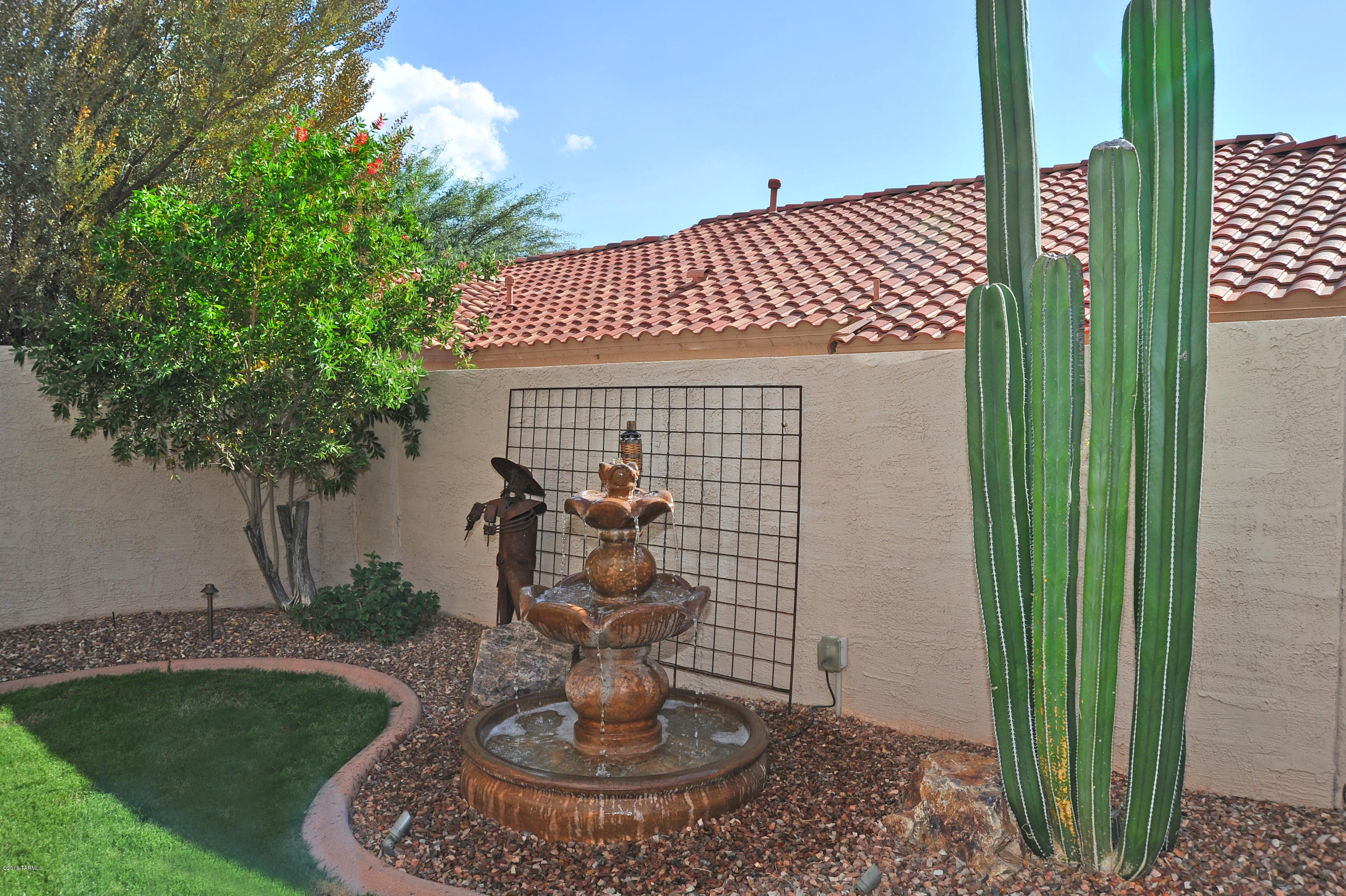 Just bring your toothbrush!  Move-in ready home in the heart of Oro Valley.  High efficiency HVAC new 2009, carpet in master newer, master bath remodeled with granite surround in shower and granite counters/dual sinks, soft colors highlight arches and kitchen.  Stainless convection oven/stove, microwave and frig, RO system and soft water stay. Split floor plan gives privacy for guests as well as the owner and the den could be easily converted to a 4th bedroom.  Ceiling fans thru-out, uplighting in the great room, windows have new rollers including the slider.  The professionally designed backyard oasis includes a covered patio, small lawn w/curbing and the soft sound of water trickling from the tiered fountain.  There is room for a pool and example is included in the photos.