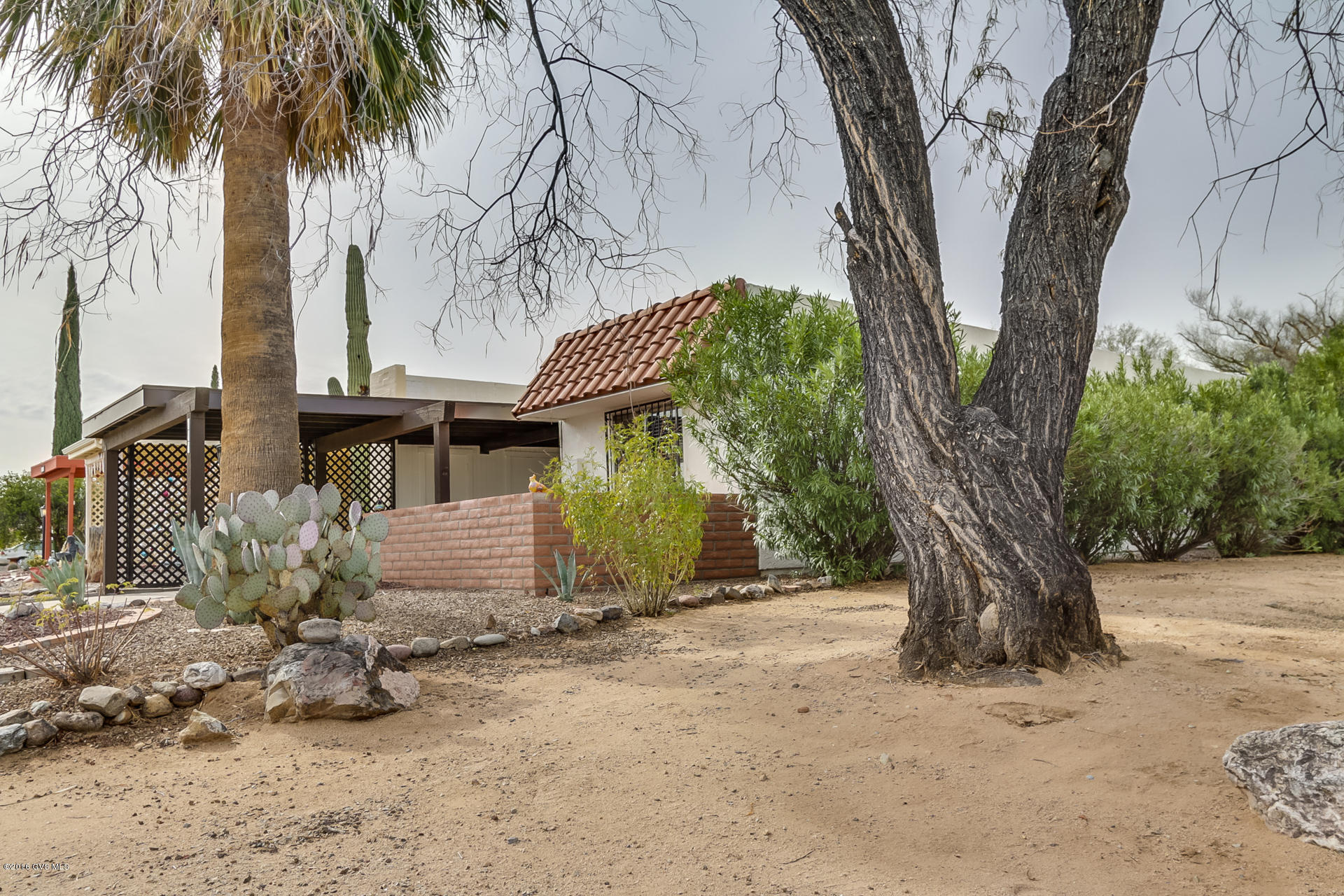 This is a terrific 2 BDRM, 2 BTH 1332 sq. ft. end unit townhouse with common areas that enhance privacy on three sides. The home has striking southwest paint colors and neutral tile blended with carpet in the bedrooms and formal areas. The home has attractive decorative security screens on the windows and doors. The front patio has been enclosed and offers views of a desert garden and mountains. You will love the large Arizona room that functions as a family room with pleasant views of backyard and common area. The galley kitchen is enhanced by a roomy breakfast nook and convenient pantry closet. Don't miss this affordable desert gem!