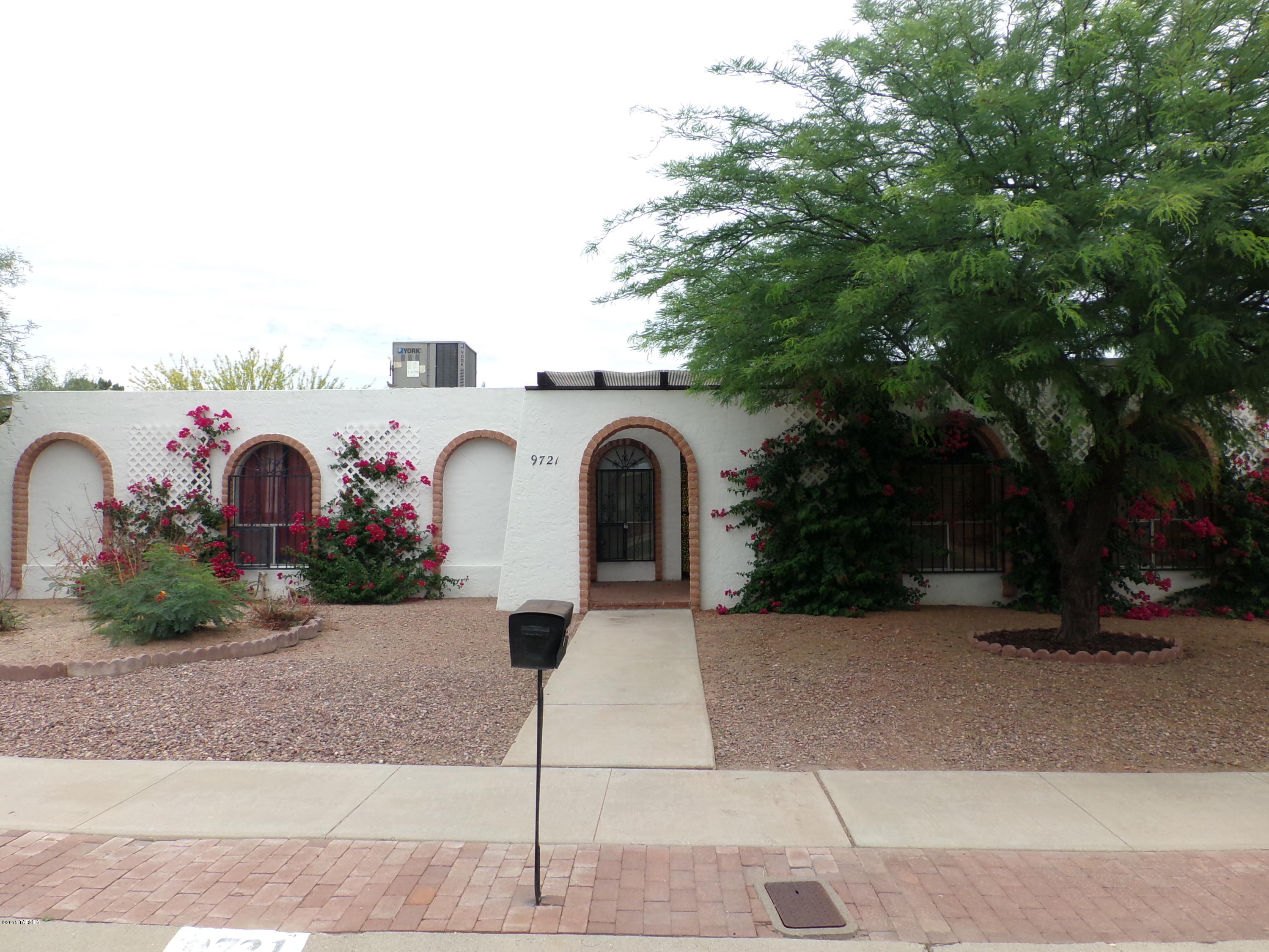 Come see, buy and move right into this well maintained 3bd,2 ba spacious floor plan that boasts 2215 Sq Ft on a huge corner lot in very convenient and desirable east side locale. Enjoy the sunken living room with fireplace and flexible separate family room/dining room off kitchen.  The front yard is tastefully landscaped and the back yard well manicured grass and ample room for a pool with 2 large storage sheds.  This one is priced right and ready to move, come and get it!!!!