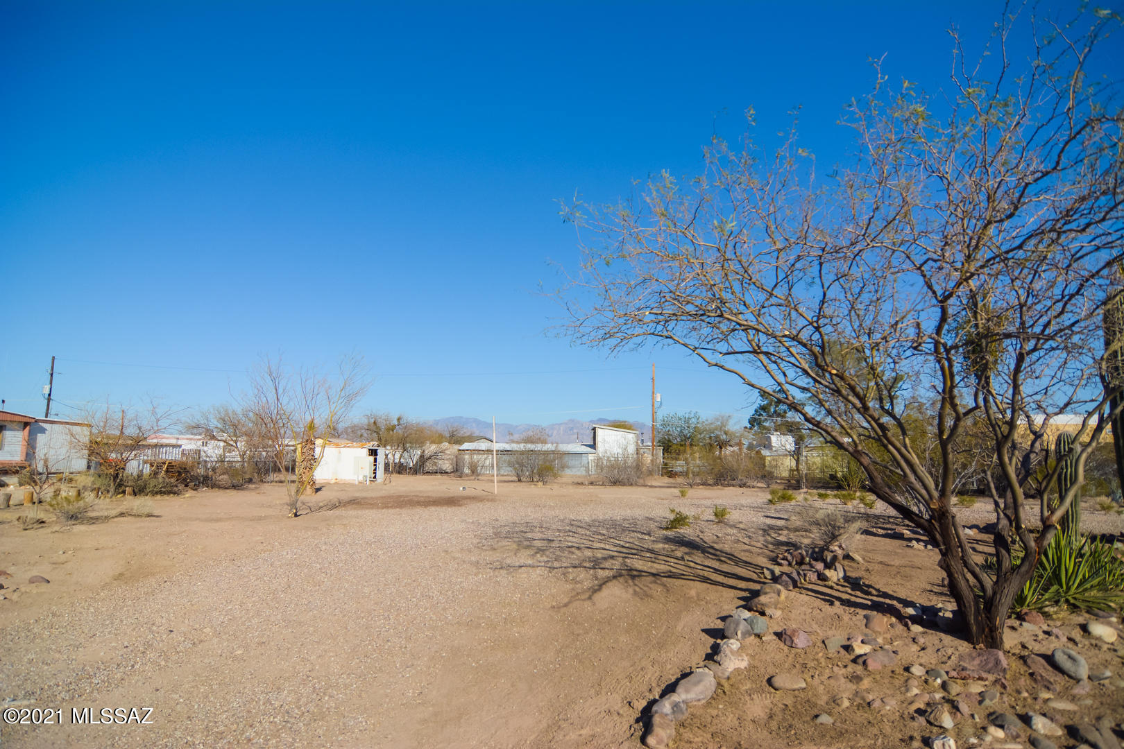 This vacant lot is ready for a new manufactured home. All utilities and septic is ready for hookups. Located in a scenic Northwest Tucson location. Pick your own manufactured home on this ready to build desert landscape.
