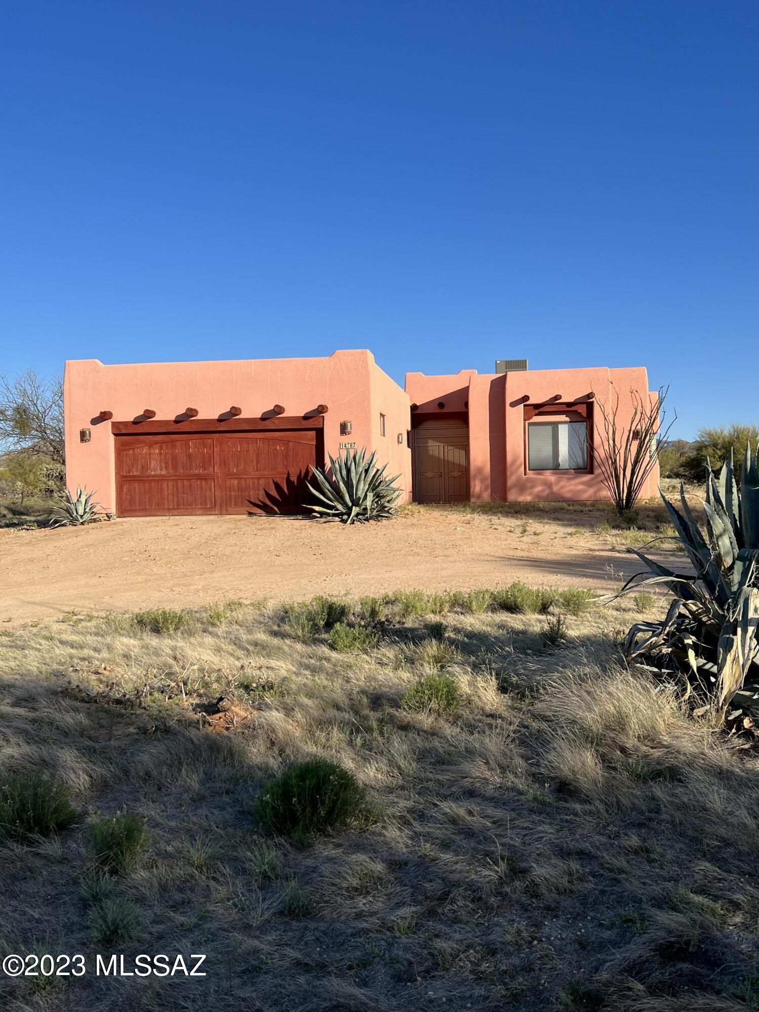 This beautiful semi-custom home sits on approximately 2 acres of lush untouched desert in the established community of Diamond Bell Ranch. Located only minutes from Tucson and you have all the walking and hiking trails you can dream of just outside your front door! The acreage allows for you to make your dreams of land ownership a reality! Bring your horses, toys or fur babies and live the dream! The home boasts Alder-wood cabinets with inlays of Saguaro ribs that brings nature into your home. Home has 3 large bedrooms. The owners suite is extra large with bay windows for a sitting area. Room also includes a sliding glass door to the patio to enjoy that first  hot cup of coffee while watching the sunrise the birds, deer, javelinas and other wildlife.
SEE SUPPLEMENT!! The third bedroom features a Murphy Bed that allows for the room to double as an office, crafting, sewing or an art studio. The home features a large kitchen with bar seating and dining area adjacent to the patio for grilling.  Enjoy a nice warm fire in the Bee Hive wood fire place during the cool winter months. The third bedroom features a Murphy Bed that allows for the room to double as an office, crafting, sewing or an art studio. Your views from the front of the home are the beautiful  Baboquivari Mountains are where you will enjoy watching the breath taking Arizona sunsets. The Baboquivari range is where the famous Kitt Peak Observatory is situated. This home will be able to be financed FHA, USDA, VA, and Conventional or Cash. Seller is offering buyer credit at closing for new paint or buyer concessions. This home is stunning has so much to offer! 
(mustang does not convey)