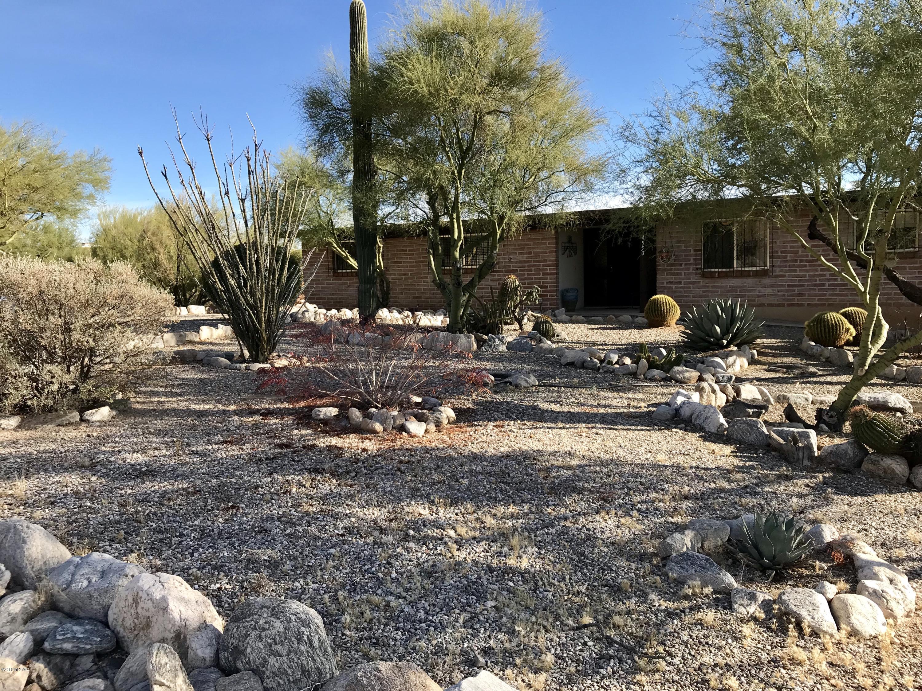 This foothills home is a must see.  Extremely well cared for with million dollar views.  Extra storage off the garage, a workroom with a half bath and an RV garage.  Enjoy the Catalina's outside your front door and mountain and city views from your large back patio. Windows in all the right places and a view from every window. Immaculate and move in ready.