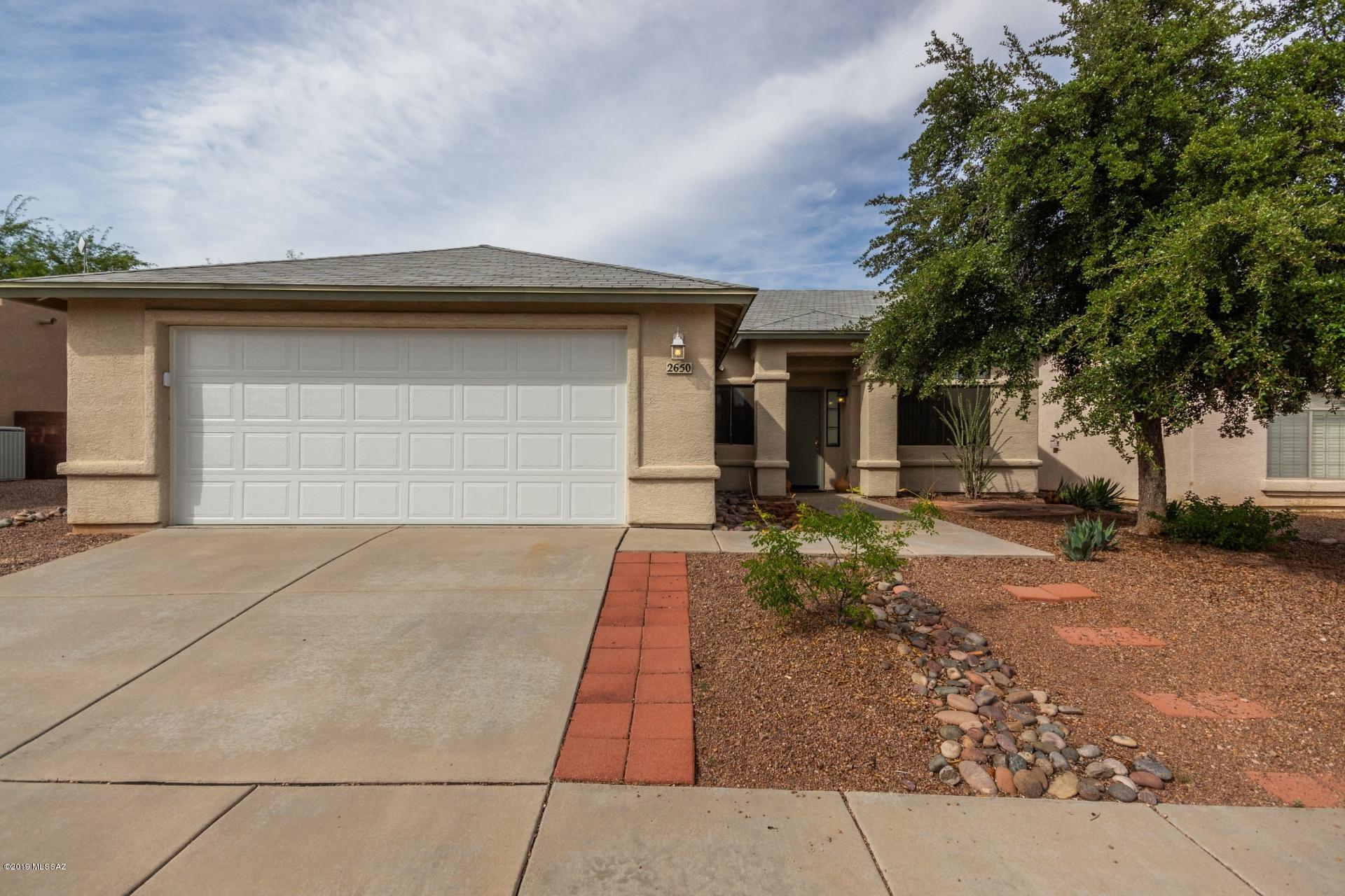 Impeccably maintained model like home. Versatile floor plan w/casual & formal areas or game room. Spacious Eat-In Kitchen Nook & Breakfast Bar that overlooks rear yard that backs to common area w/no houses behind. Vaulted ceilings, decorative soffits, upgraded fixtures, neutral colored tile, natural light & designer accent paint finishes add distinctive appeal. Spacious master bath with executive height dual sinks, garden tub & custom shower.  Enjoy outdoor entertaining in private rear yard with flagstone covered patio & accent flagstone wall. Rear wall raised for additional privacy & gated side yard for dogs or storage. New plumbing,  Air condition and appliances (refrigerator, washer and dryer).