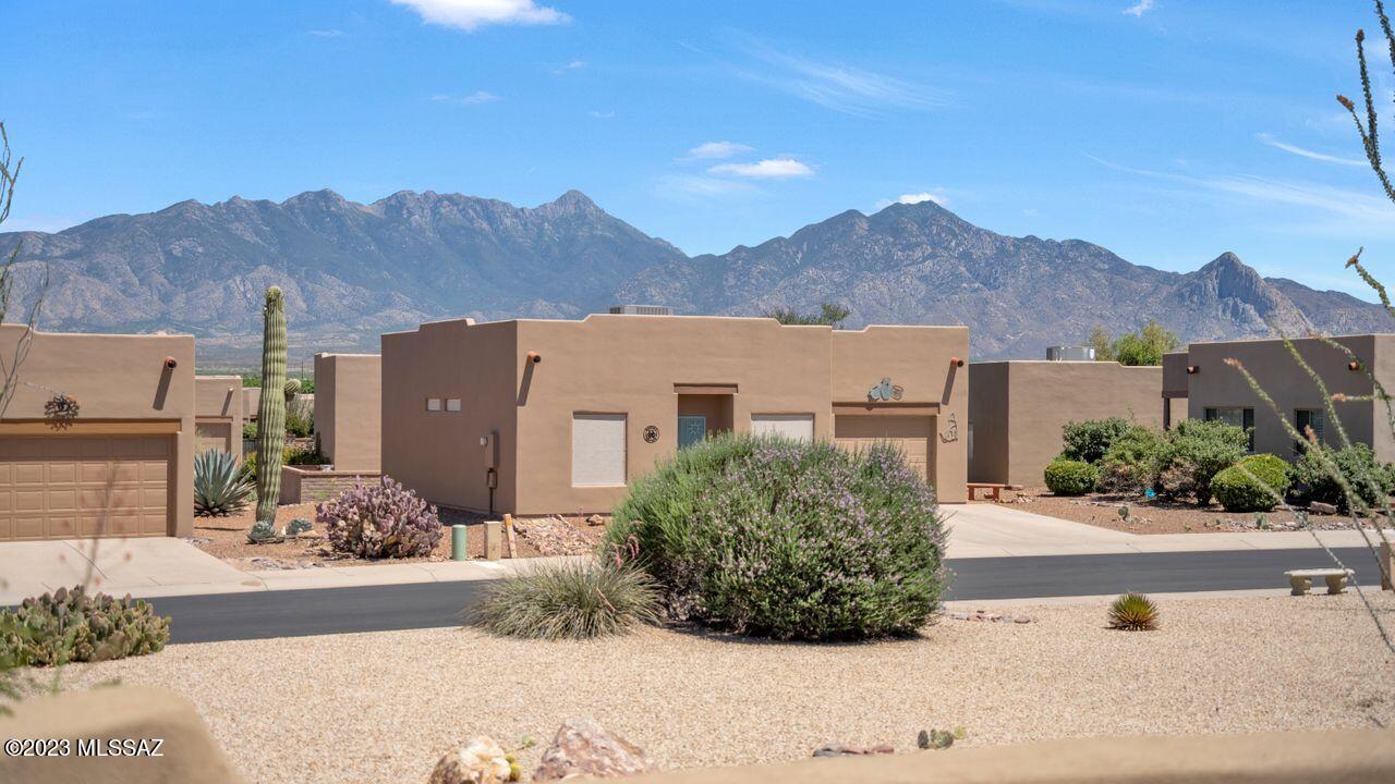 The ideal orientation so you can enjoy viewing the Santa Rita Mountains at sunset while basking in the shade with your favorite beverage!  2BR/2BA/2GAR with easy - care tile and wood-look laminate flooring throughout.  Home has been well-maintained by owner.  All appliances included.  You're only a block and a half from the fabulous Santa Rita Springs GVR Rec Center and all amenities.