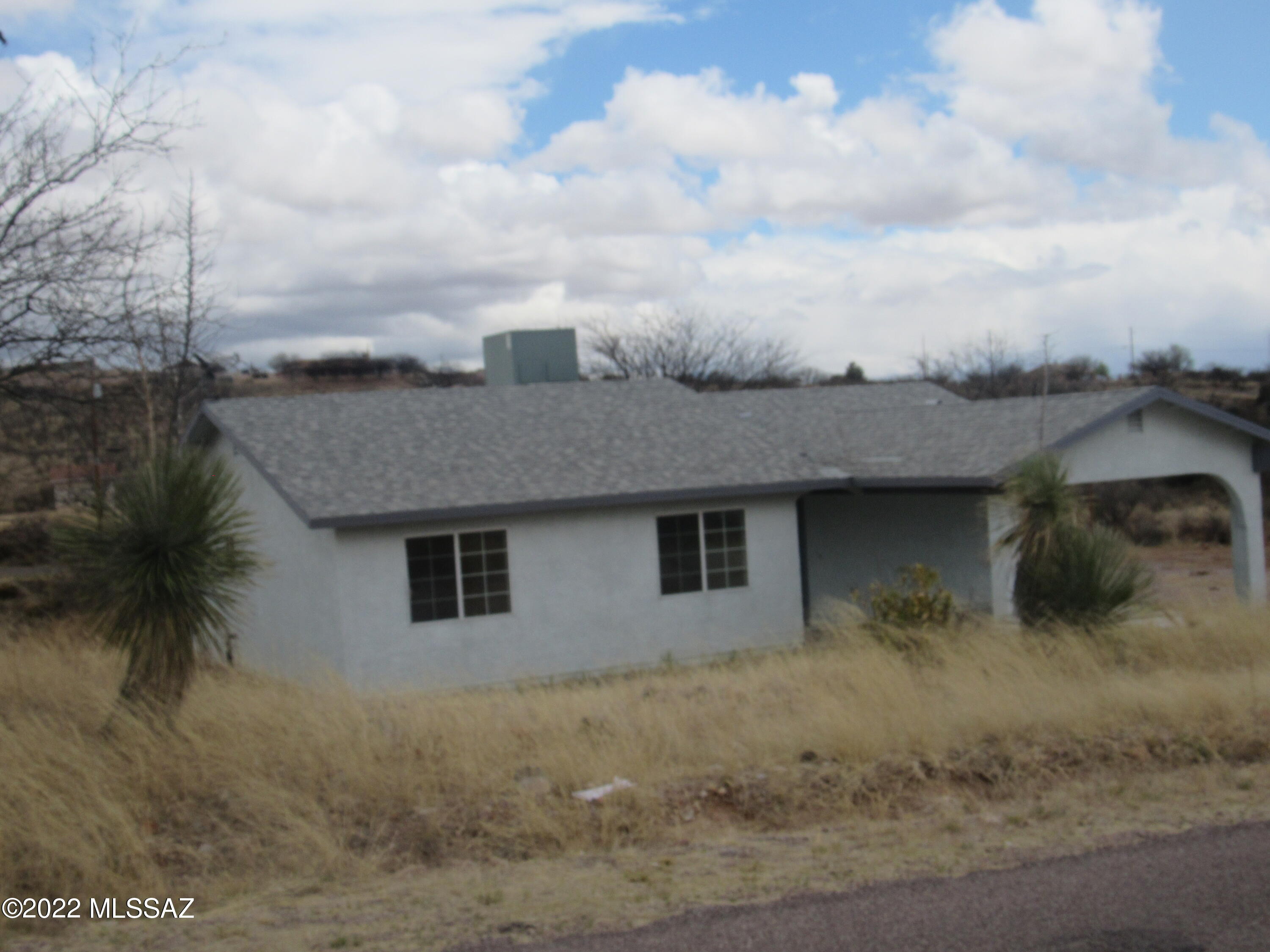 Three bedroom, two bath home features 1203 sq. ft. living area, all electric. Single carport, frame and stucco, shingle roof, evaporative cooling, view lot.