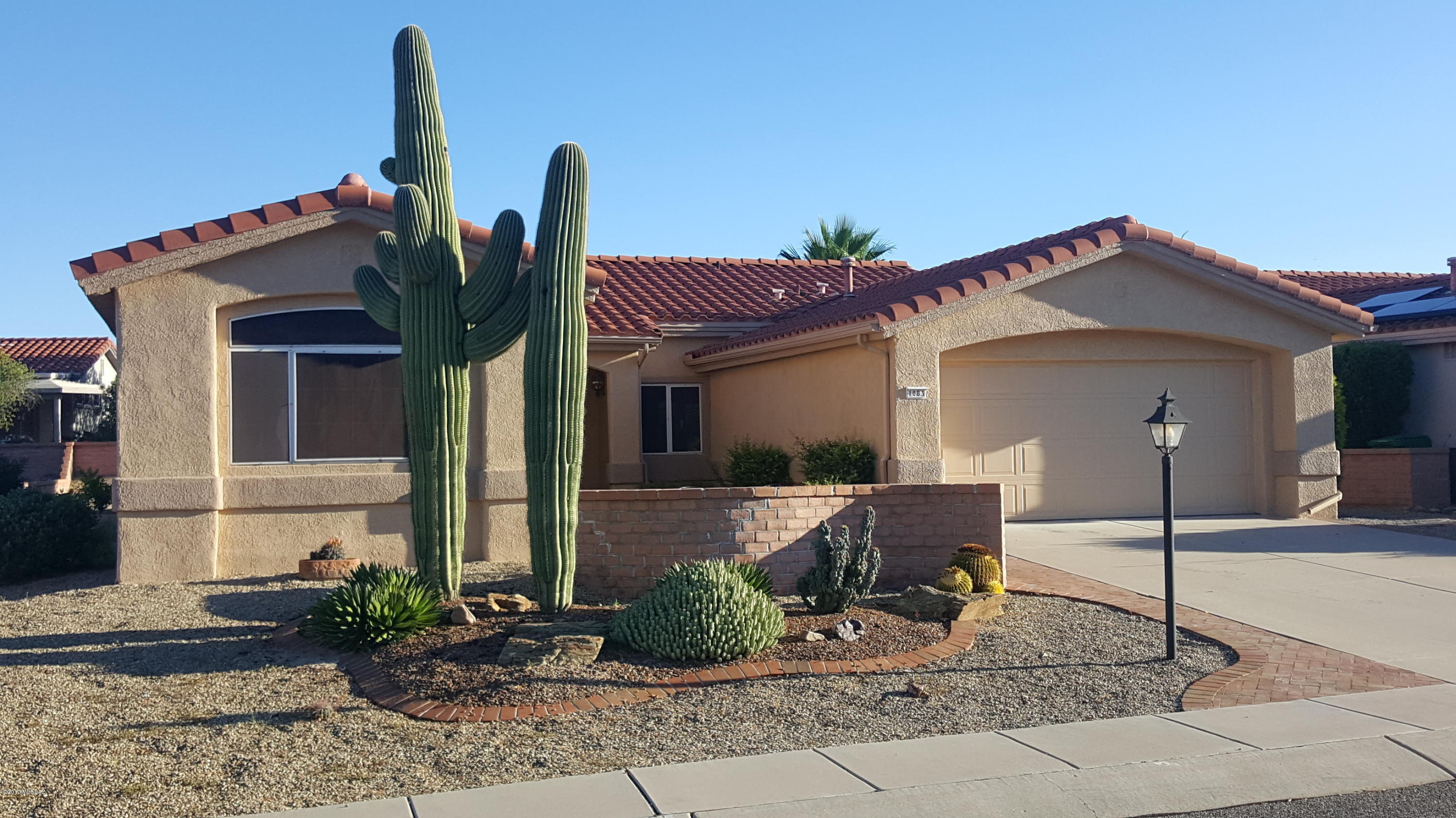 Great Sun City Oro Valley Remodel. Open Plan Expanded Crescent Model with Den. New Kitchen and Baths with Granite Counter tops and under-mount sinks. GE Adora “Slate” Appliances. Interior Newly Painted in Custom Gray Tones. New 12x24 Porcelain Tile throughout home. New Kohler Faucets. Great Den with Murphy Bed. 6 Contemporary Ceiling Fans/Lights. All lighting in home is LED. Laundry Room including New Utility Sink. Exterior Recently Painted. Extra garage cabinets on both walls. Nice Solar Screens are removed but in the garage. Front Courtyard with excellent Mountain Views and Landscaped Yard with 2 large Saguaros. Private Backyard is very large with Covered extended Paver patio.  Move In with no work to be done and Enjoy all the Sun City Amenities.
