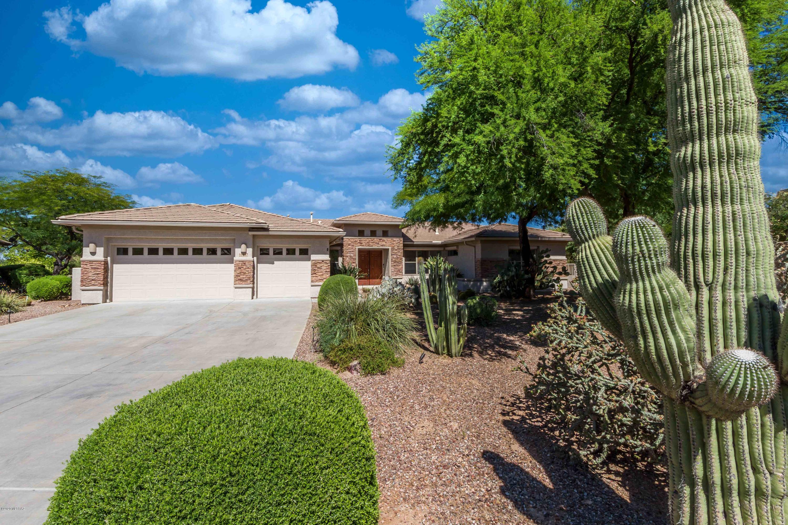 Unbelievably beautiful turn-key home on expansive lot with pool in the heart of Oro Valley! Come be impressed by this stunning 4 bedroom plus den with open plan & 3 car garage on enormous cul de sac lot in Copper Ridge! Fresh paint, new carpet and fixtures, double ovens, granite, stainless, extended cabinets, surround sound, & too many lovely touches to list. Master en suite with garden tub and separate shower. Gorgeous neutral ceramic in all common areas. Gas fireplace for cozy gatherings in the formal living area. Outside, mature vegetation, Birds of Paradise, Mandarin, Orange and Lemon trees fill the yard w/ abundant fruit & songbirds. Sparkling Pebble Tec pool & spa & extended patio for entertaining friends & family!  Over 3000 square feet gives new owners the space to live and love!