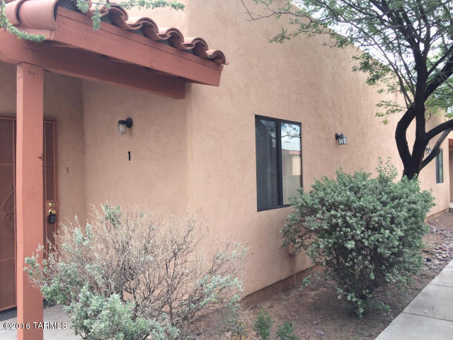 Here's a great 2 bedroom, 2 bathroom unit in a great central location! One of four units in a modern fourplex, it features tall ceilings, living room with fireplace, laundry closet with hook-ups, nice generous kitchen cabinets and work area, dining area, covered rear patio and small yard, ceiling fans, refrigerator, oven, dishwasher, one covered carport space, and more! Convenient to shopping, services, restaurants, and the U of A.  Owner is a licensed realtor in the state of Arizona.  Good value! Call today!