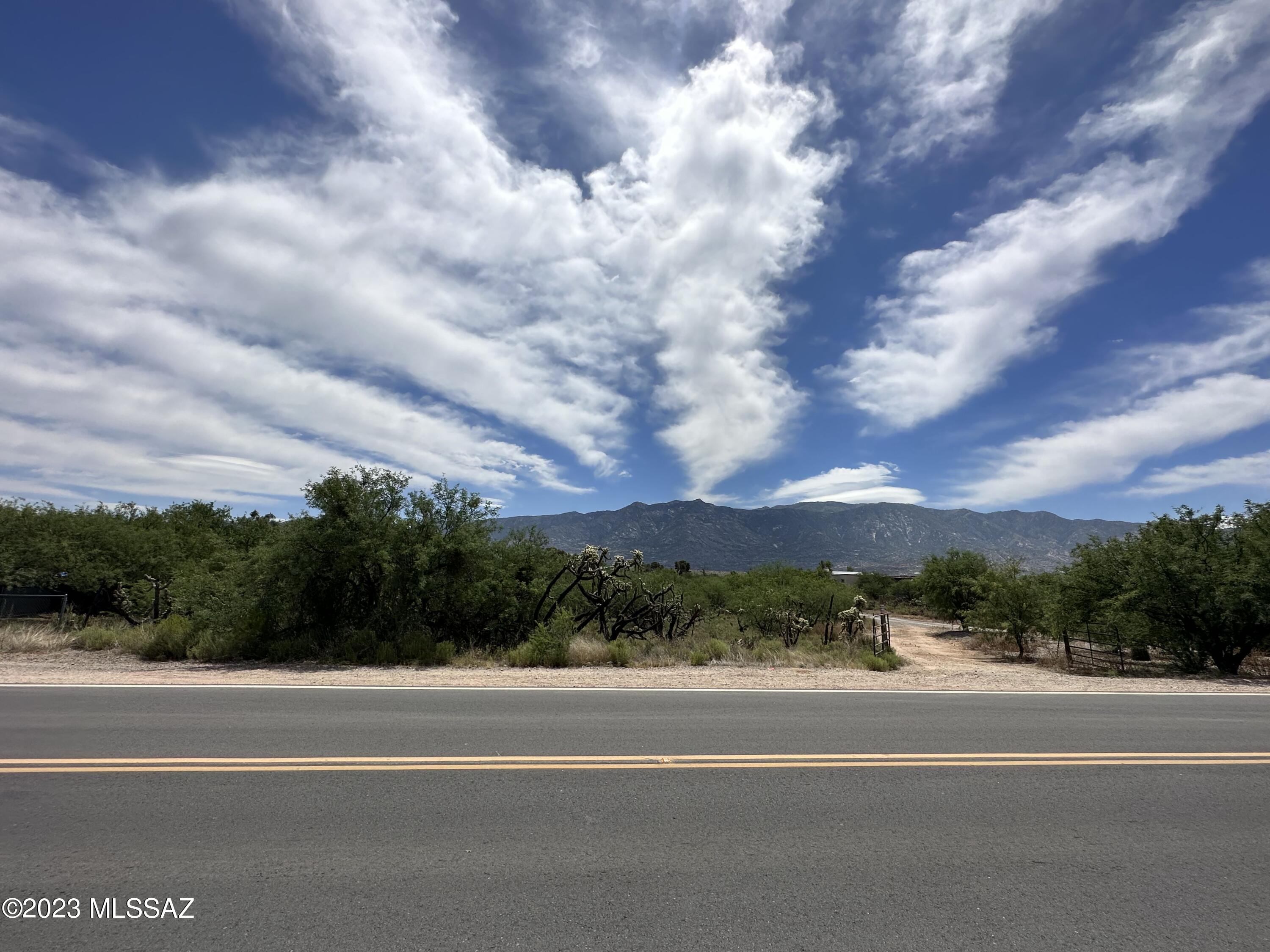 Vacant land perfectly situated with amazing views of the Catalina Mountains. At just over an acre you can build or put a manufactured home on this GR-1 zoned lot with no HOA. Easy access location is minutes from Oracle Rd (SR77) and nearby shopping. Go check it out! Drive has easement for use of owner of lot behind (single gate), the private drive to lot is the double gate. Buyer to verify all including access to utilities.