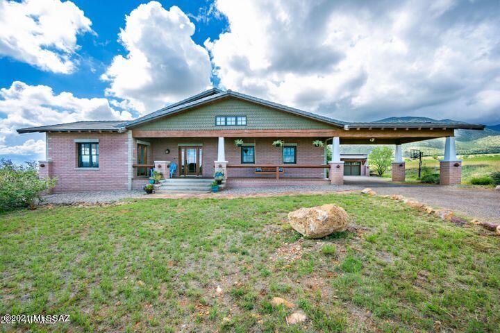 Unique opportunity to own an impressive Craftsman Style home on nearly 4 acres. This stunning home is spacious, warm, filled with intricate details and views that will amaze you!!! You'll be able to easily view the Huachuca & Mule Mountain ranges. 4 bedrooms, 3 bathrooms, large bonus room and so much more. Brand new washer & dryer convey with the sale. Come take a seat on the fantastic, custom porch swing and take in the striking views!!!