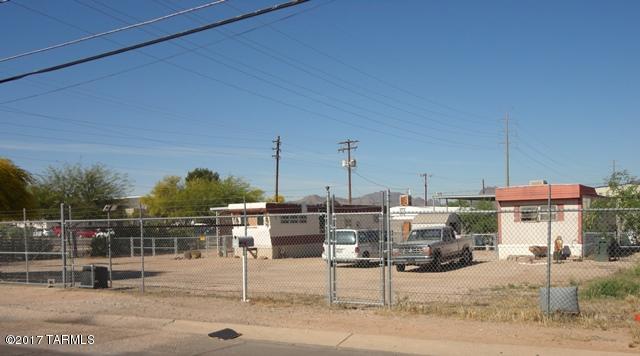 MH-1 zoned lot with utilities already on the lot. Zoned for manufactured home(s). Fully fenced with chain link fence, block rear wall, and lockable chain link gate. Currently has 2 mobile homes on lot and lot does have utility hookups for 2 separate homes. The 2 homes currently on this parcel are owned by the lot tenants and can be removed as the lots are being rented month to month. Adjoining lot also available MLS#21709112