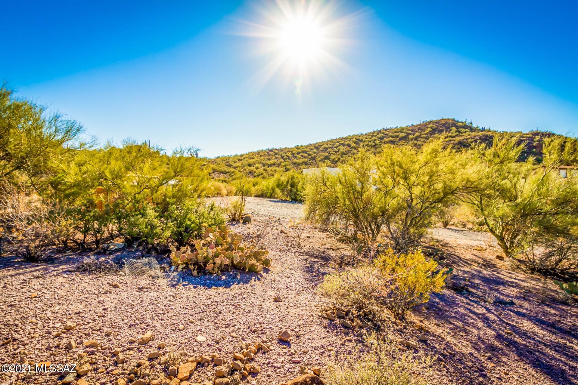 Stunning Sunrises, Mountain views, & lush desert vegetation. Bring your builder & Architect to create your dream home.  Over an acre of land w/all utilities to the lot line. Plenty of space for all your toys & a desert oasis. Take a tour today & start building.