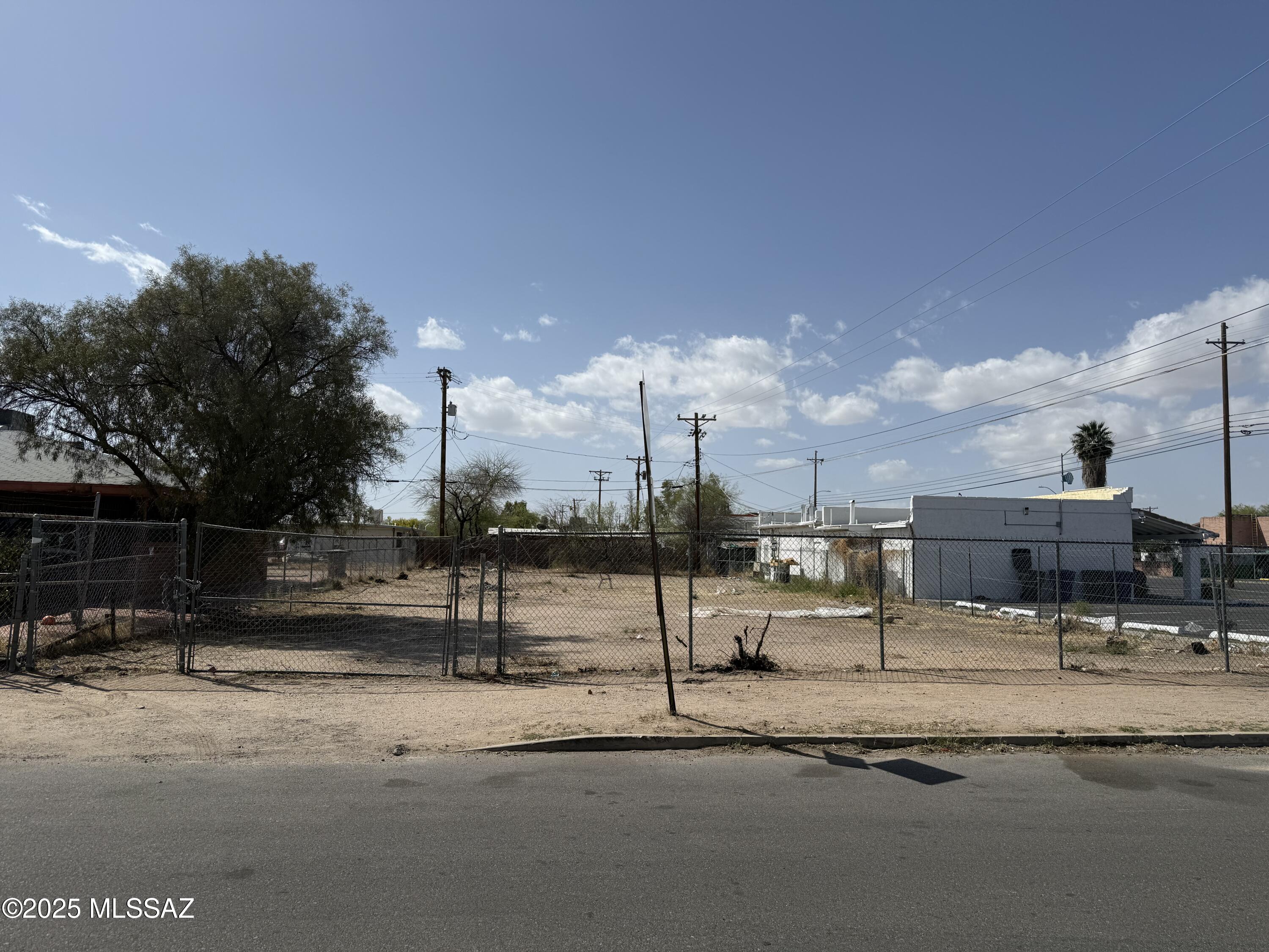 This 6,276 square-foot lot offers a fantastic opportunity for development in the highly sought-after City of Tucson. Zoned R2, it's ideal for building a duplex or a single-family residence. The lot is fully fenced and equipped with utilities at the lot line, providing easy access to all essential services. Paved streets were completed in 2021 and are not part of the moratorium, ensuring smooth access and future growth potential. Conveniently located near the freeway, shopping centers, and restaurants, this lot offers both accessibility and a prime location for your next project. Whether you're a builder or an investor, this property offers a solid foundation for success.