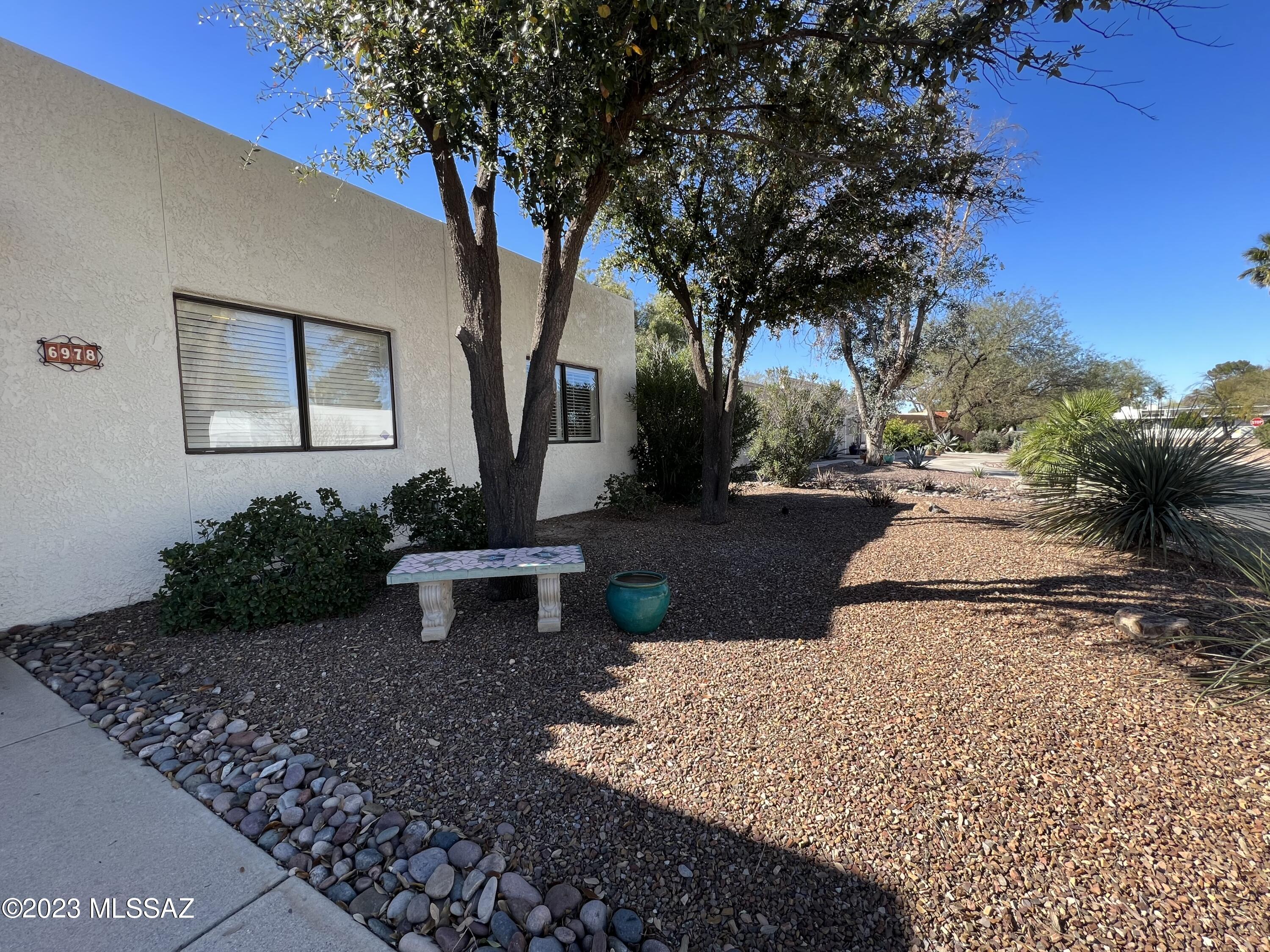 Come and enjoy this spacious, well maintained home in historic Dorado Country Club Estates. Property has both formal and informal dining and living areas. Granite countertops, plantation shutters, new paint &   ceiling fans. New AC 7/2022. Ample room for entertaining in large great room or host outside on covered patio, with huge backyard and fountain. Primary bedroom has grand bathroom suite with walk-in shower and soaking tub overlooking lovely backyard. 4th bedroom off kitchen 8X10 has potential for office/studio/workout. Low care landscaping with new drip irrigation. Mature mesquite trees with citrus ready to pick. Community pool/spa around the corner. Access to golf and minutes to 56 miles of recreational/bike paths. Most major services within one mile. Range price listing $475K-495K