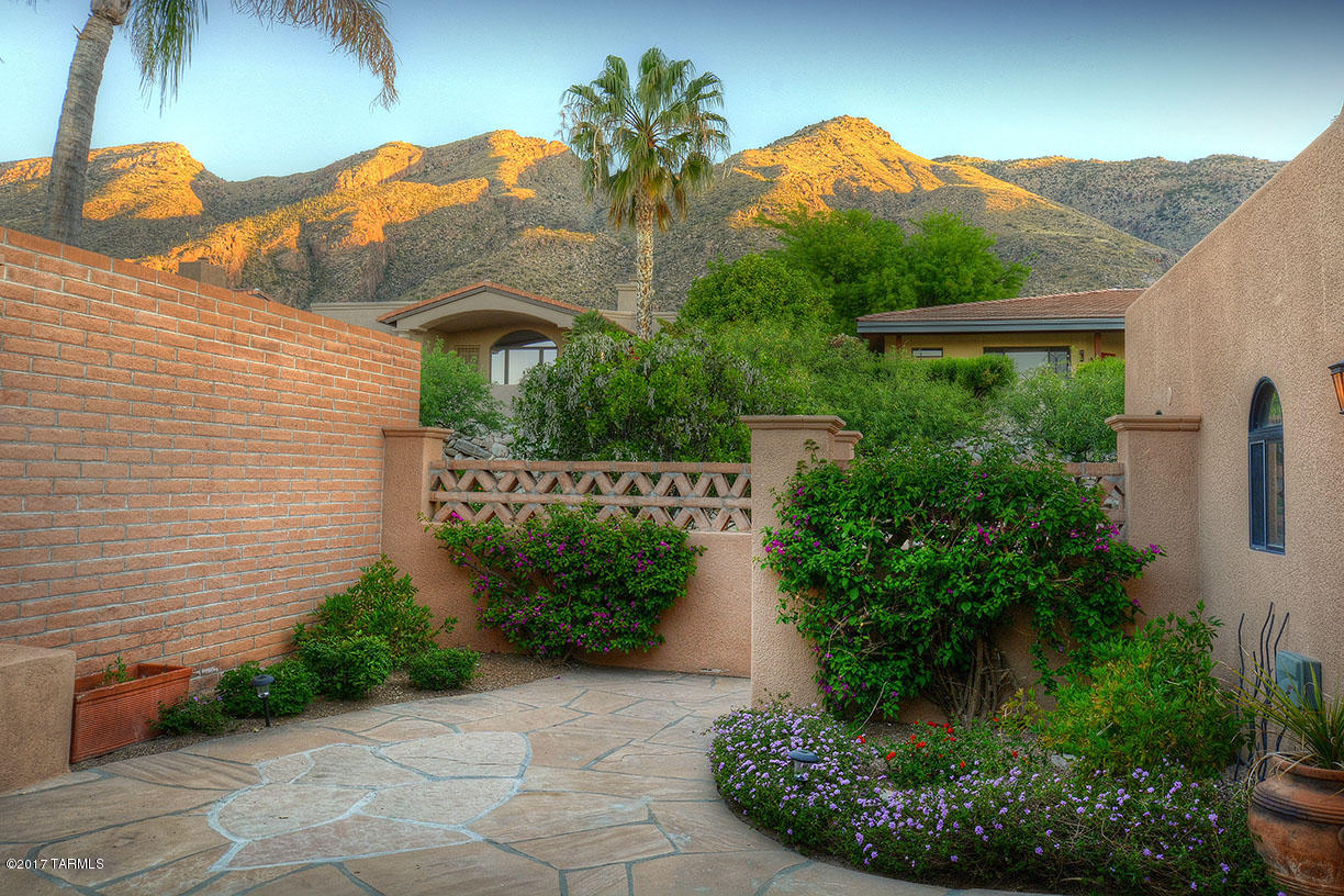 FABULOUS IN FINISTERRA! EXTENSIVELY AND EXQUISITELY REMODELED; SPACIOUS ROOMS AND FANTASTIC VIEWS! ENJOY INSPIRATIONAL MOUNTAIN VIEWS FROM THE GORGEOUS, STATE OF THE ART KITCHEN, SECOND BEDROOM AND FRONT COURTYARD WHERE YOU CAN RELAX NEAR THE COURTYARD FIREPLACE. MARVEL IN THE CITY LIGHTS FROM THE STUNNINGLY DRAMATIC GREAT ROOM, REAR PATIO AND LOVELY MASTER BEDROOM. ENTERTAIN IN THE UNIQUE WINE BAR. BASK IN THE LUXURY OF THE BEAUTIFULLY FINISHED AND APPOINTED BATHROOMS. TAKE IN THE DETAIL AND BEAUTY OF THIS VERY SPECIAL TOWNHOUSE BY VIEWING THE PHOTO GALLARY. THE MANNED-GATED SUBDIVISION OF FINISTERRA IS LOCATED IN A NATURALLY BEAUTIFUL FOOTHILLS LOCATION AND OFFERS EXCEPTIONAL COMMUNITY FACILITIES INCLUDING A LARGE POOL, SPA, TWO TENNIS COURTS AND A VERY ATTRACTIVE COMMUNITY CLUBHOUSE