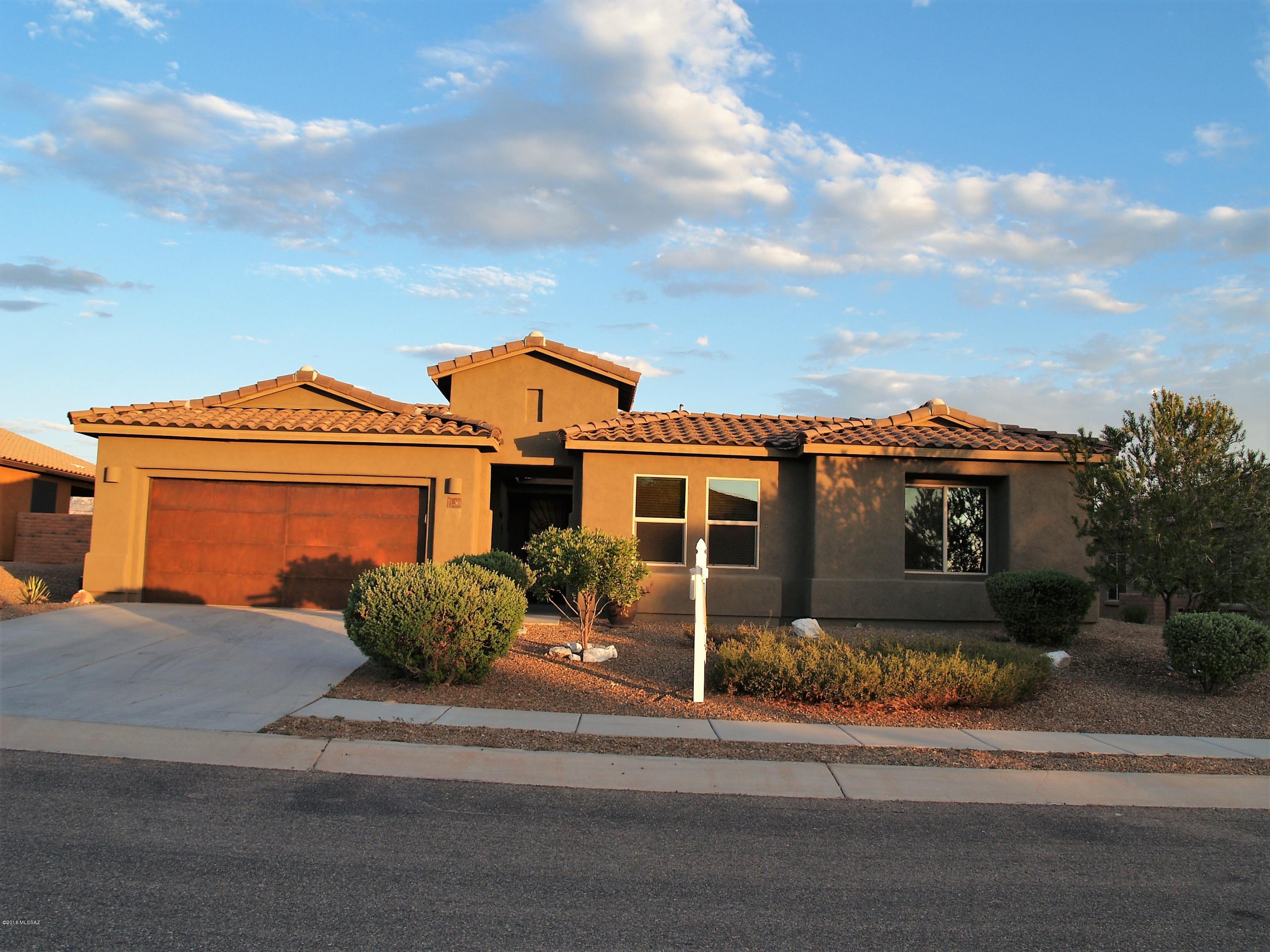 'HOME TOUR WINNER''!Gorgeous 2778 sq/ft 4BR+Den/2.5BA entertainers home located in the highly desirable Sky Ranch Estates. Beautiful inside and out with charming courtyard entry. This home has a spectacular East facing backyard with views of the Catalinas and surrounded by natural desert preserve.  A 2013 energy efficient gem features a split-floor plan. Gourmet kitchen will make you swoon w/stainless appliances, gorgeous granite tops, staggered cabinets & roll-outs, custom tile backsplash, double ovens & 5-burner gas cooktop, under cabinet lighting, walk-in pantry, butler's pantry and extra-large laundry room. Private Master Suite w/garden tub, separate shower, dual vanities, huge walk-in closet. Two car w/tandem garage. Relax outdoors while enjoying breathtaking Majestic Mountain Views!