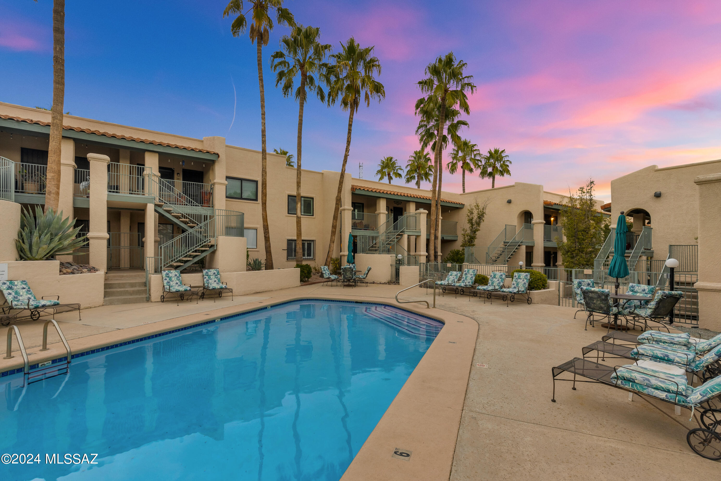 Completely renovated 2 bed/ 2 bath Ridge 22 condo w/ an uncommon level of quality & striking contemporary design. Set back down a long driveway, far back from 22nd St.  This surprisingly spacious jewel box is located along the interior courtyard overlooking the beautifully maintained pool area. Pristine community. The covered entry creates a sizeable front patio to enjoy outdoor living. Dream kitchen w/ quartz countertops & white cabinets complimented by black hardware & backsplash. SS appliances & a double sink. The kitchen w/ a breakfast bar is open to a family room. New bathroom features include new vanities, new mirrors, new light fixtures, new toilets, new black plumbing fixtures & new custom tile surround to the ceiling. Private balcony off of the primary suite. CONT... Additional spacious bedroom. Newer carpet, designer paint. Sleek front loading washer and dryer. Plantation Shutters. Conveniently located on Tucson's east side in a small enclave of condominiums with 2 pool areas. Brand new water heater installed Feb 24 Close to Jesse Owens Park, Lakeside Park, Fred Enke Golf Course, and Pima County's Loop River trail. Tons of options for dining and shopping. Well-established HOA, immaculate subdivision.