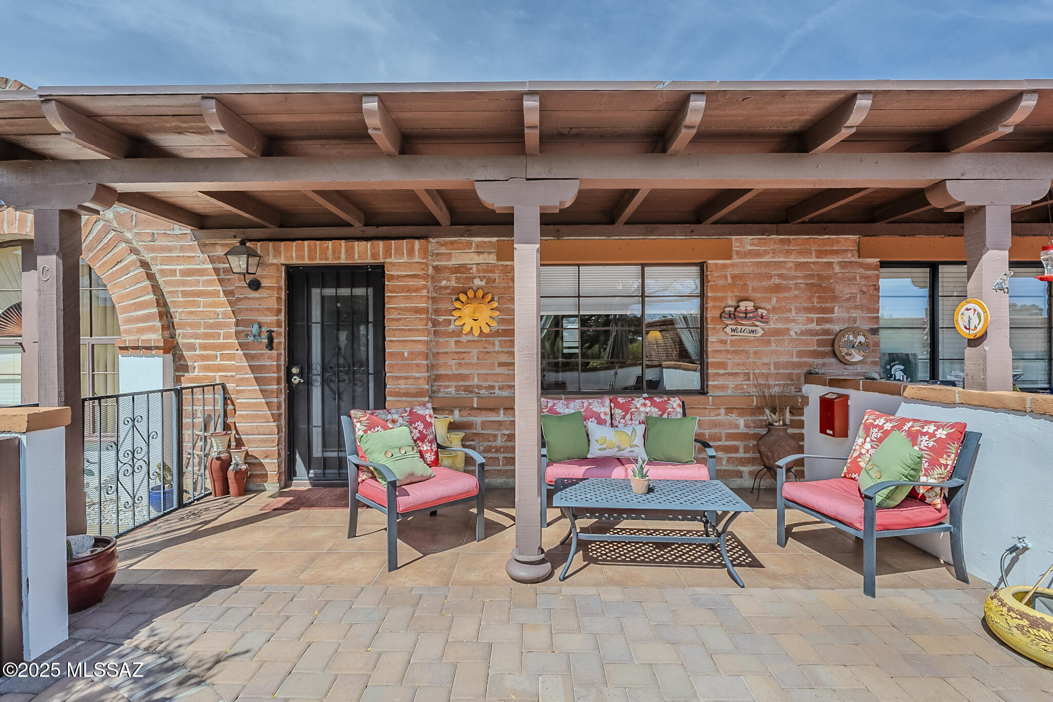 This charming NO GVR fully furnished one-bedroom, one-bathroom villa with 588 square feet of living space and an east-facing patio that provides a pleasant outdoor retreat, offering the opportunity to enjoy the fresh air and the surrounding environment. Once inside the villa, the southwest-inspired decor creates a warm and inviting atmosphere.  With comfortable furniture and beautiful southwest decor throughout the home it is a very welcoming and relaxing environment.

The unit boasts Terra Cotta-finished Walnut cabinets that add a touch of rustic elegance to the kitchen area, equipped with a gas stove, offering efficient cooking capabilities.

The accent walls showcase a faux-finish paint treatment, adding depth and visual interest to the living space. The interior boasts ceramic tile flooring throughout, creating a low-maintenance living environment. For added convenience, the unit includes a washer and dryer located in the attached shed, along with an additional storage cabinet. This fabulous villa provides both inviting outdoor and indoor spaces with the designated parking conveniently located in the rear and a ramp up to the back door. Move in ready - just bring your suitcase and groceries