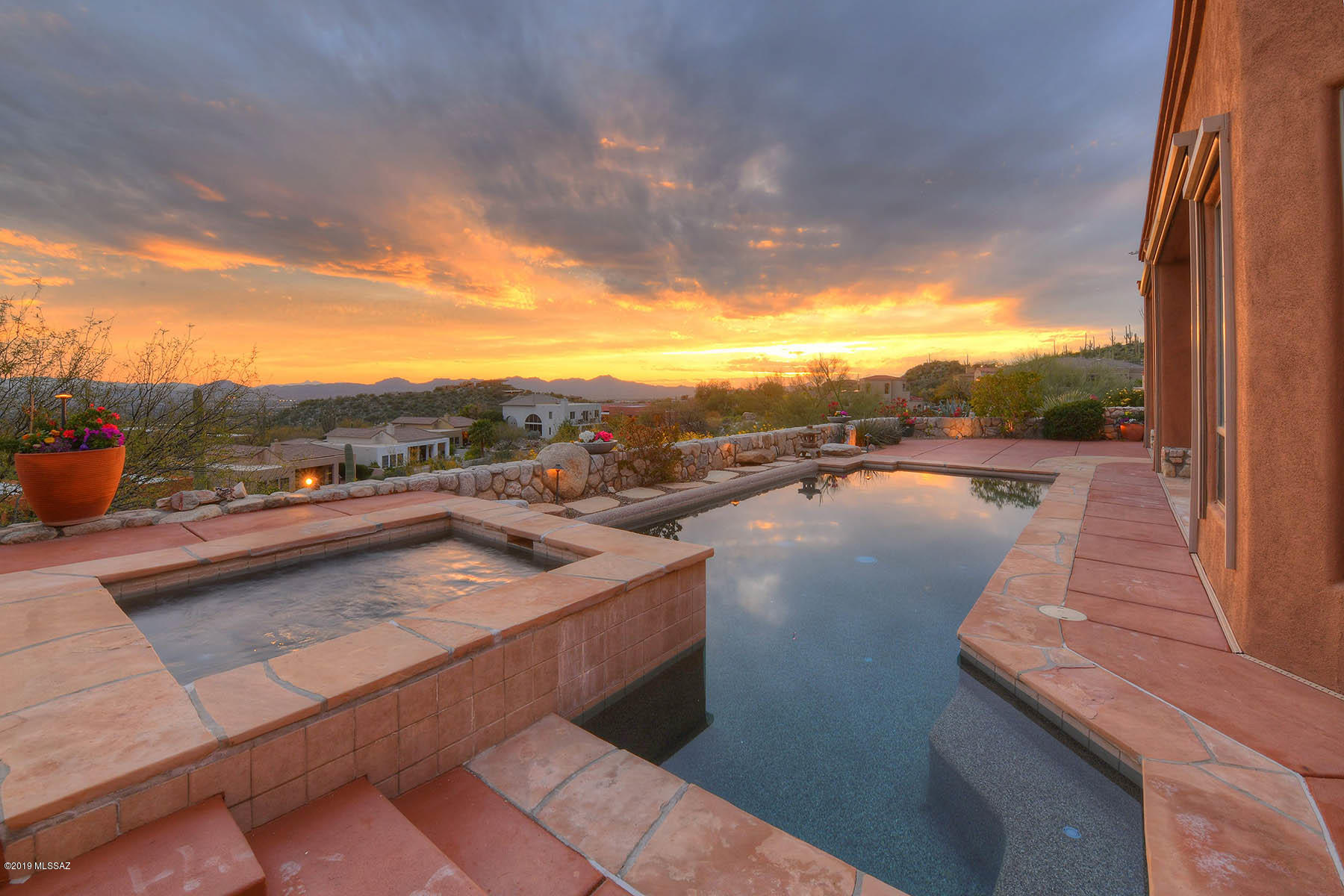 Outstanding City & Mountain Views From This One Level, Upgraded, 3,315 SqFt  4 Bedroom &  4 Bath Contemporary Home in The Gated Community ''The Summit At Finger Rock''.
This Kevin Howard Designed Home Offers A Bright & Open Floor Plan, Travertine Flooring, Great  Room w/High Ceilings, Walls Of Windows, Designer Light Fixtures and Window Coverings, Gas Fireplace, & Dinning Area All Open to a Spacious Island Kitchen w/ Stainless Appliances, Gas Stove, Double Oven, Granite Counters, and Breakfast Bar. Other Features Include, All Ensuite Bedrooms,  Exterior Rolling Shutters, & Oversized 2 Car Garage. Private BackYard w/ Covered Patio, Built In BBQ, and Sparkling Pool & Spa Overlooking All of Tucson. Ideal Central Foothills Location Close To Hiking Trails & Tucson's Finest Shopping & Dining.