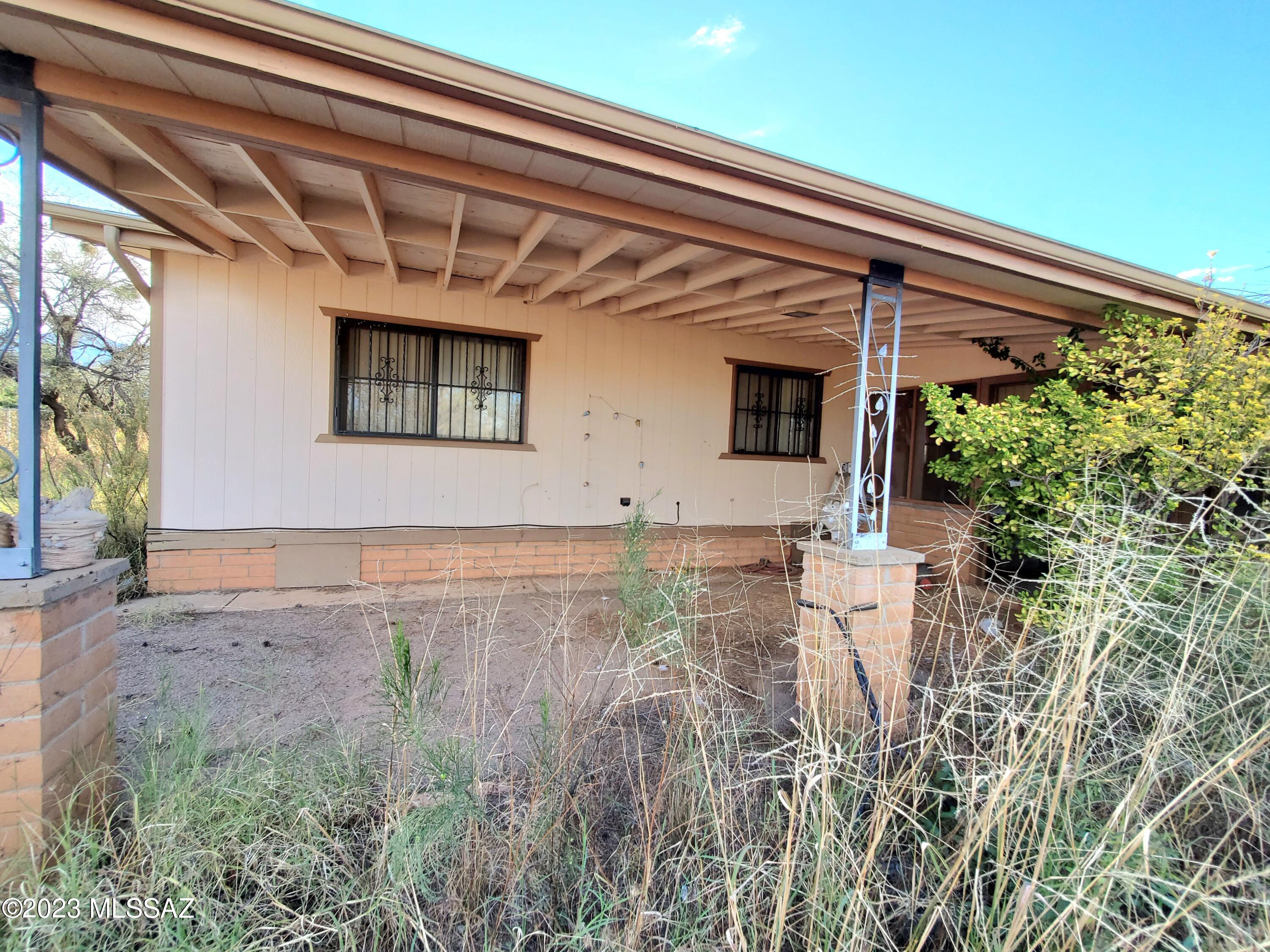 Opportunity knocks! With some TLC this property will shine again! 3 bed/2 bath 1,300 sq. ft. manufactured home on almost an acre lot. Mature trees. Carport. Storage building. Come home to a peaceful, rural feel but still be close to shopping and in town amenities.