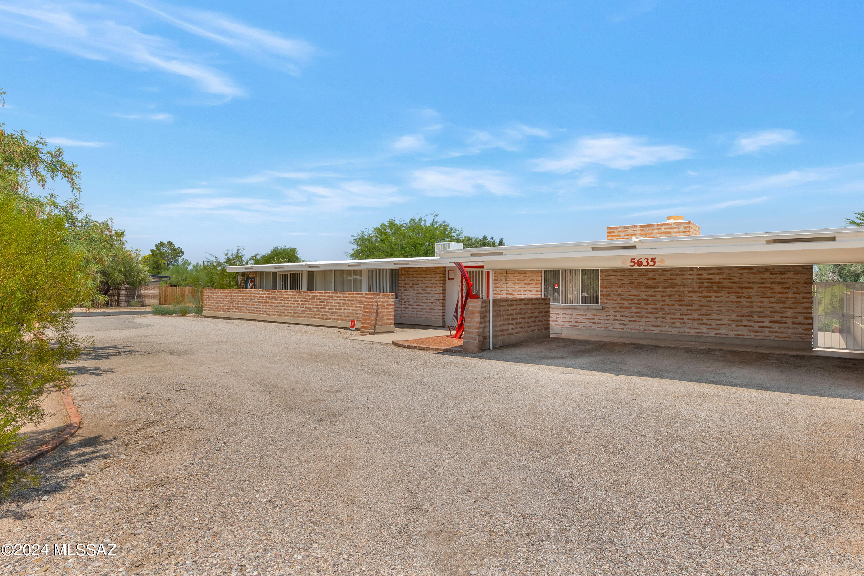 Nestled on a large corner lot w/ views of the Catalinas, a Tom Gist designed mid-century home waiting for you to decorate to your lifestyle. The living room overlooks the large pool and the yard is a perfect size for fun w/ family or friends..games, cookouts or just relaxing  & enjoying the pool.Shed ceilings so typical of the 1950's and wood ceilings in kitchen/family room add character & interest. Large master bedroom  has a large walk-in closet and a private walled patio.
THE POOL NEEDS RESURFACING AND THE HOUSE IS IN AN ESTATE. PROPERTY BEING SOLD IN''AS IS'' CONDI TION. SELLERS TO MAKE NO REPAIRS. HOME PRICED ACCORDINGLY. The air condition is brand new 14 seer(2024).Electrical panels  updated 2024. SCULPTURE IN FRONT DOES NOT CONVEY BUT CAN BE PURCHASED BY SEPARATE BILL OF SALE
