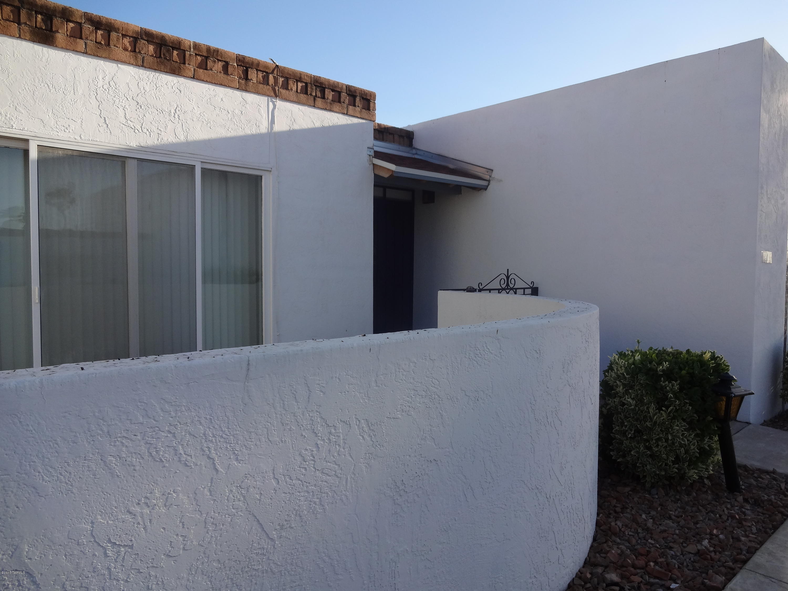 This well cared for home has newly  installed carpeting and a kitchen with Granite counter tops and an island where  you can put several bar stools. Two large bedrooms with 2 full baths. A very large laundry room that comes with a washer and dryer. Refrigerator, microwave and stove are included as is. Dual cooling. Swamp cooler as is. Don't miss out on one of the largest townhouse in the community!