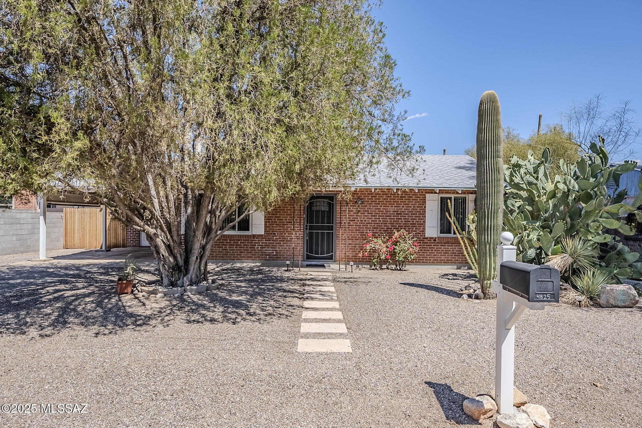 Step into style and comfort with this beautifully remodeled mid-century home, located in a prime central location just minutes from shopping, dining, and everyday conveniences. Built with classic wire-cut brick, this 2-bedroom, 1-bathroom home offers timeless charm with modern upgrades throughout. With 840 sq ft of thoughtfully designed living space, the home features new tile flooring, recessed lighting, and a bright open layout. The kitchen has been fully updated with granite countertops, New cabinetry, and stainless steel appliances, making it both functional and stylish. The remodeled bathroom offers a fresh, modern touch with quality finishes. Enjoy the outdoors on a spacious lot with mature trees, a large covered patio, and plenty of room to relax or expand. New roof in 2025.