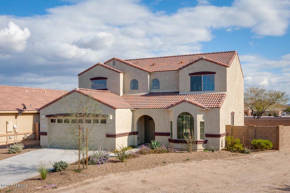 California contemporary in popular Algodon at Gladden Farms. New build, never occupied, well-appointed upgrades, on over-sized pie shaped lot with no neighbor to the rear of the home. Formal living + dining rooms with light and bright picture window. KITCHEN: Gorgeous earth-tone, polished slab granite w/ square edge, contrasting warm wood cabinets, and complimentary cool stainless steel appliances. GREAT ROOM: Sliding glass door to backyard covered patio, neutral carpet. MASTER SUITE: spacious, neutral carpet, French door to private patio w/ mountain views, walk-in closet, his + her sinks with polished slab granite counter w/ travertine tile backsplash, soaking tub, walk-in shower, and contemporary black hardware + fixtures. BEDROOMS: Nice sized w/ mountain views and deep closets.... .....BACKYARD: large, private, mountain views, plus a covered patio. Seller will give $2,000 credit towards backyard landscaping or window coverings. Don't miss out on this brand new, never lived in home.