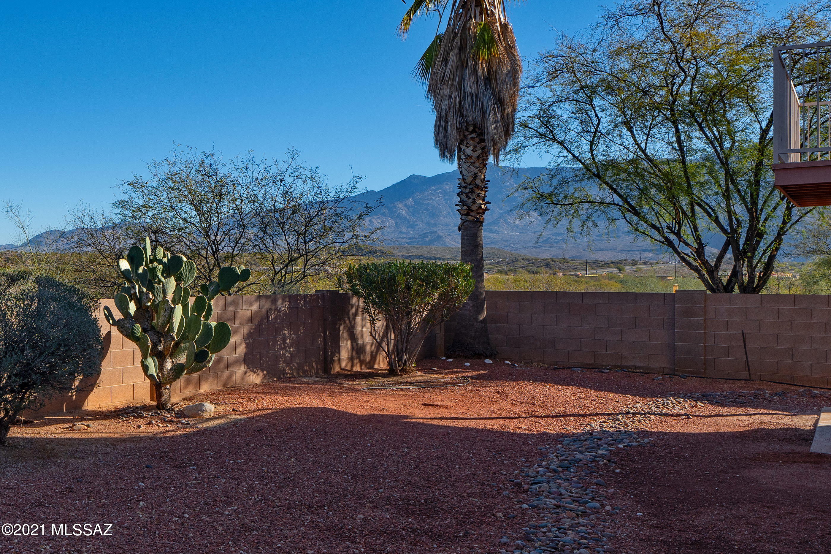 Spacious AF Sterling 4 bedroom, 3 bath home in the heart of Oro Valley with Catalina AND Tortolita mountain views. On the banks of Sausalito Creek with NO ONE behind but natural desert, you can enjoy stunning sunsets while relaxing in the private outdoor space or from the large balcony off the primary bedroom. Soaring ceilings, light filled rooms and 2242 square foot floorplan has loads of possibilities. All new paint and carpet throughout, NO POLY (piping replaced in 2020). Lower level offers gas fireplace, flexible living spaces, kitchen, laundry and guest bedroom with full bath. Upper level boasts primary bedroom with ensuite and two walk in closets, two additional bedrooms with walk in closets and a third full bath. Two car garage and room for a pool. N/S exposure. Needs a little TLC.