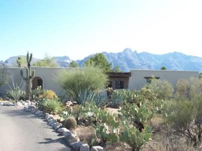 Wonderful territorial style home with fireplace in livingroom, lots of ceramic tile, split guest room, new glass top stove, and all kitchen appliances provided. Private pool, city and mountain views! Ask for #1961.
