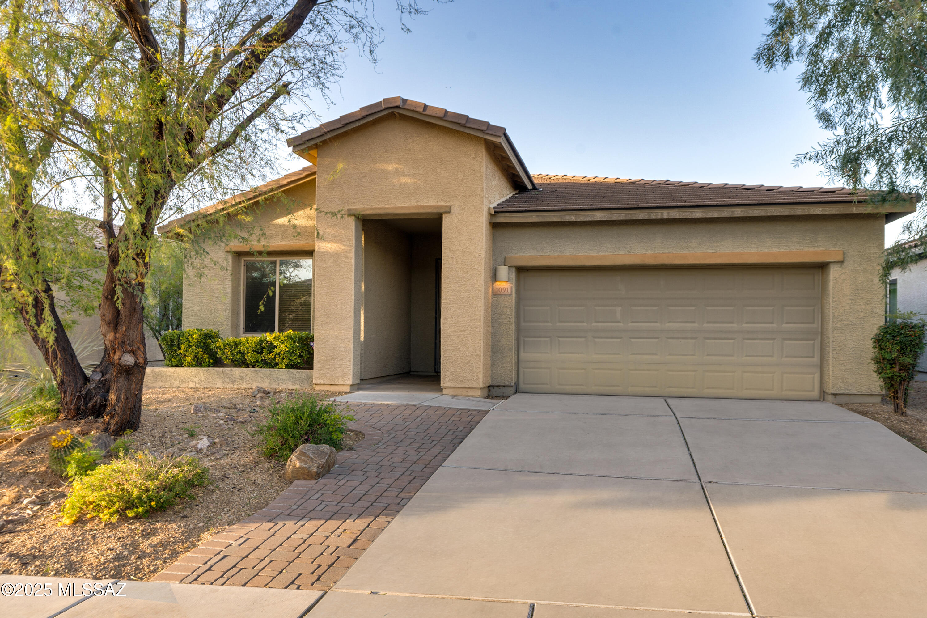 Discover this well maintained home in the desirable Sahuarita community of Madera Highlands Village! This single story, 3 BR 2 BA home, built 2012, is move-in ready, and just recently updated with fresh paint throughout and new carpet in all the bedrooms. Interior features incl. neutral tile floors in all the common areas, 9' ceilings, upgraded kitchen with granite counters, stainless appliances, gas range, reverse osmosis, pantry closet. Spacious great room and dining areas off kitchen. Large backyard is the perfect outdoor oasis, offering mature shade trees, large grass area and built-in natural gas BBQ. This former Meritage spec home has several extras, including the extended rear covered patio, and 4' garage extension for larger vehicles. Plus, a brand new HVAC installed May 2024.