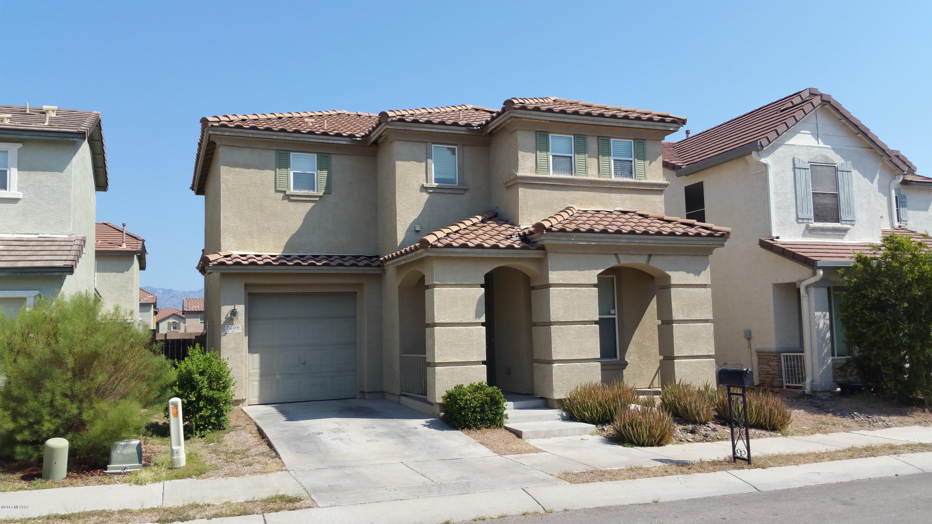 Real Pride-of-Ownership in this 3 large Bedrooms & Den/3 Bathrooms and a huge loft, great for family space or easy conversion to another bedroom. Spacious, updated home with awesome laminate flooring upstairs and beautiful custom tile downstairs. Kitchen features new Stainless Appliances, large pantry, tile counters with a pass-through (add counter for breakfast bar). Open staircase, lots of ceiling fans, and other architectural features make this a very attractive home.  2nd floor laundry room for convenience, and plenty of closet/storage space.  Home is great for entertaining in a well maintained quiet neighborhood.