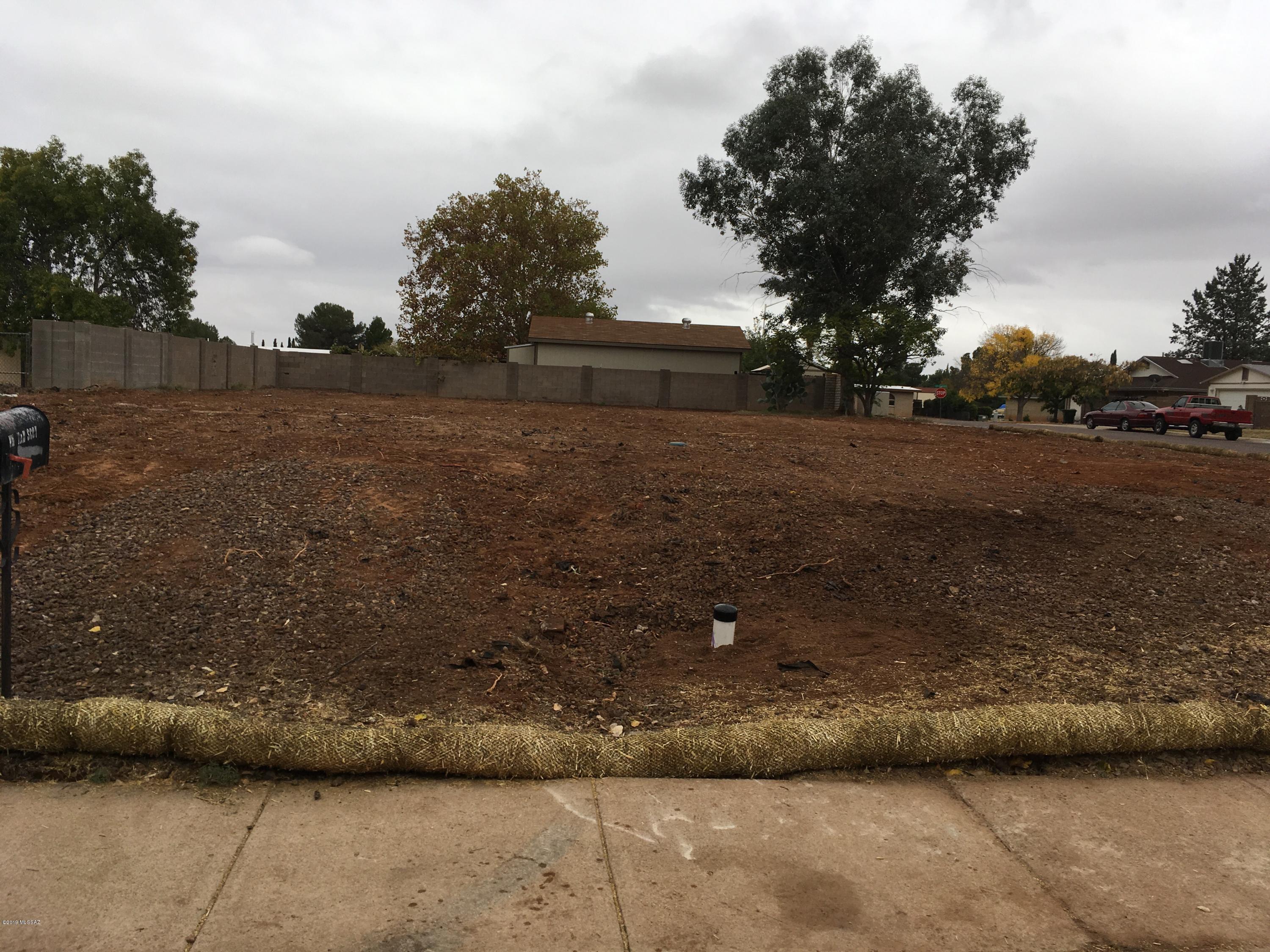 Infill corner lot in established subdivision in eastern Sierra Vista - close to schools and shopping - most of the neighborhood was built out in the mid to late 70's - Utilities in place from previous single family home